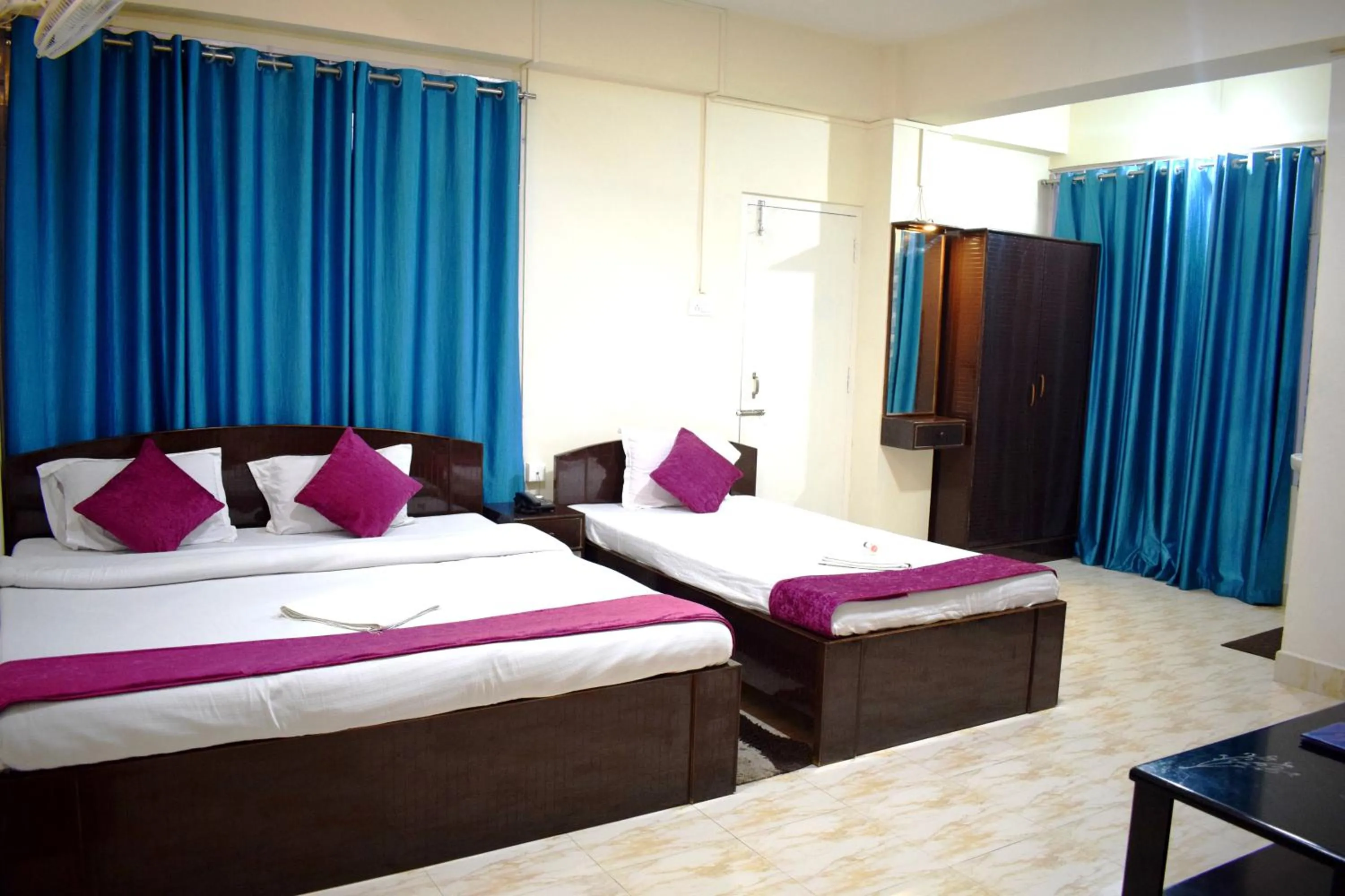 Bed in LILY GUEST HOUSE