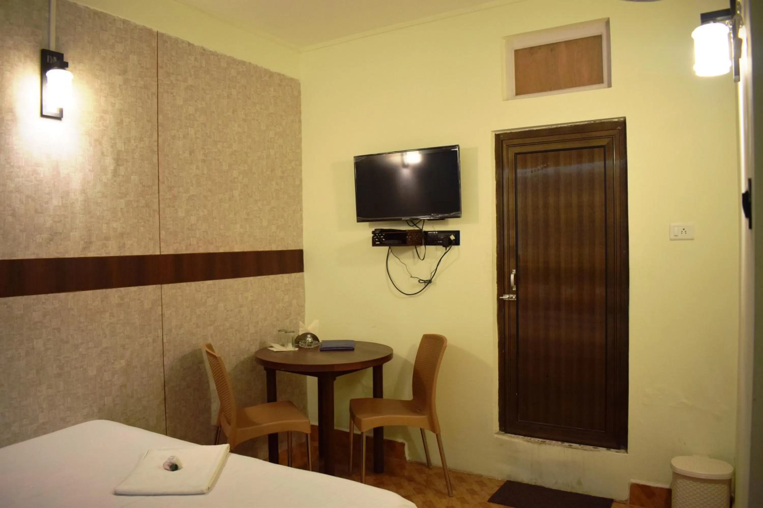 Bed in LILY GUEST HOUSE