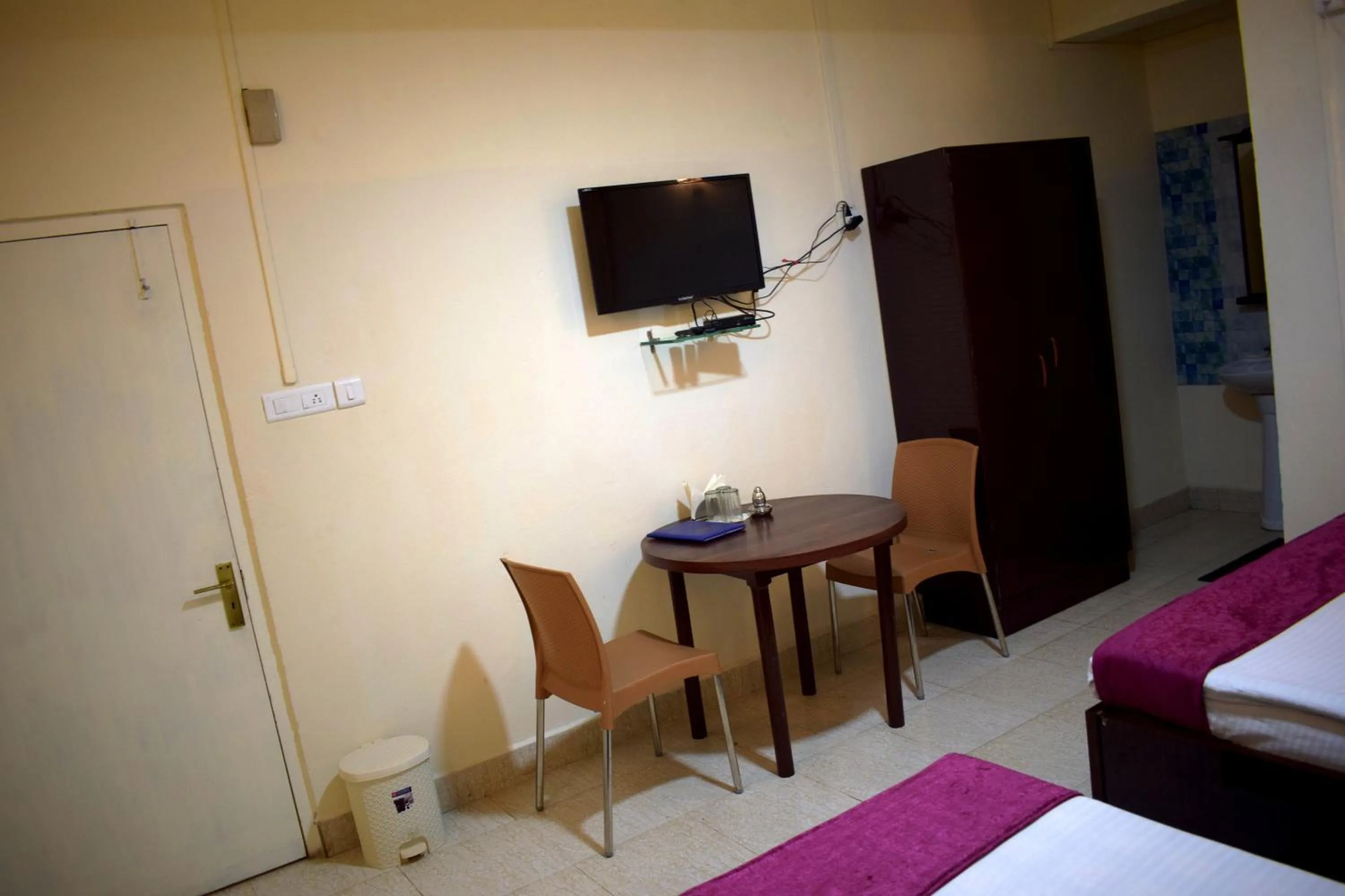 Bed in LILY GUEST HOUSE