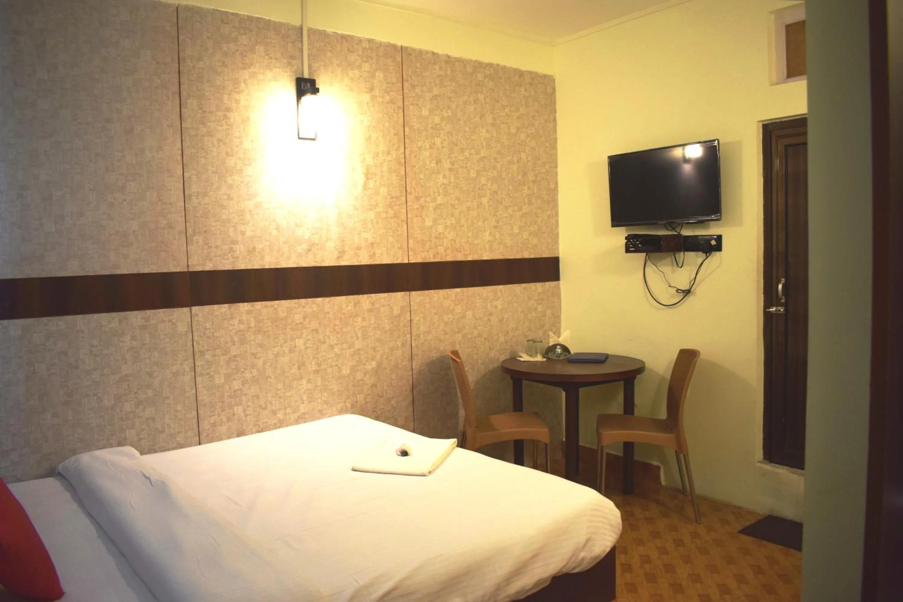 Bed in LILY GUEST HOUSE