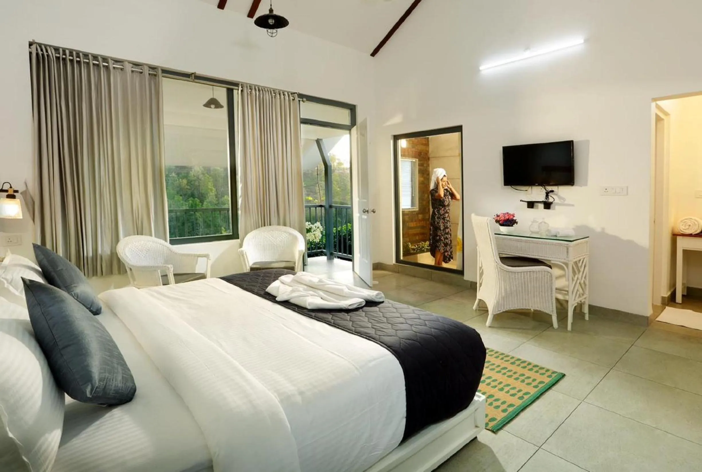 Communal lounge/ TV room, Bed in PEKOE Plantation Cottages by LexStays