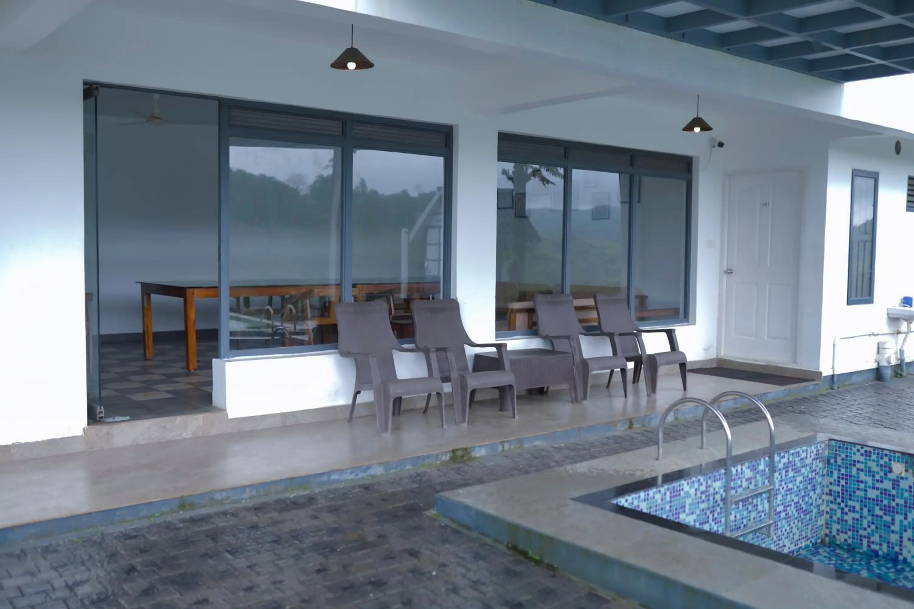 Pool view in PEKOE Plantation Cottages by LexStays