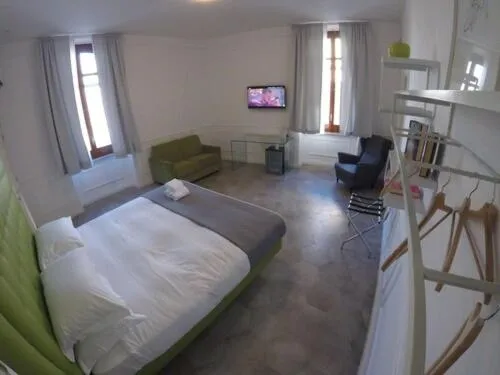 Bed in RAVIDA SUITES