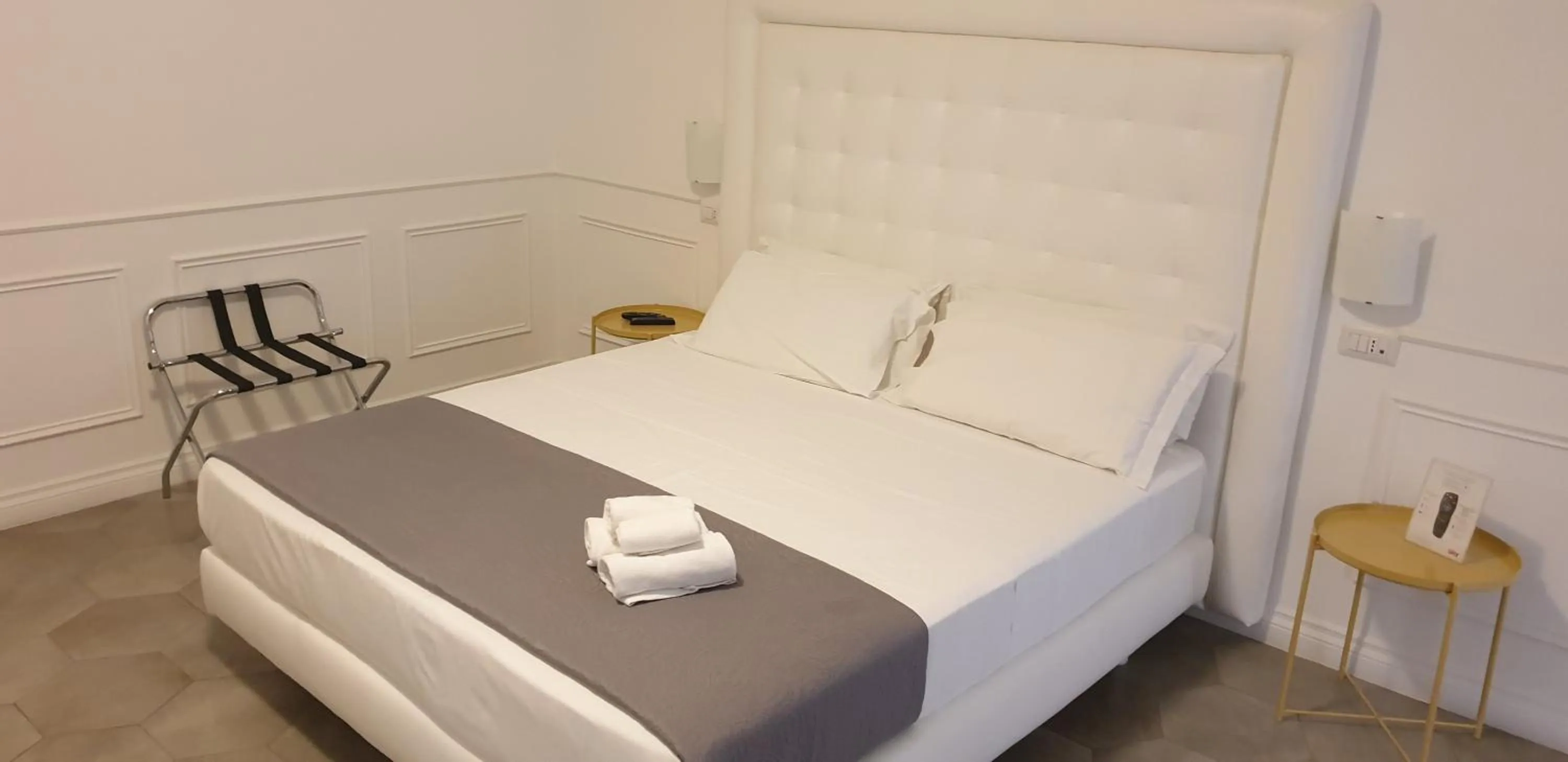 Bed in RAVIDA SUITES