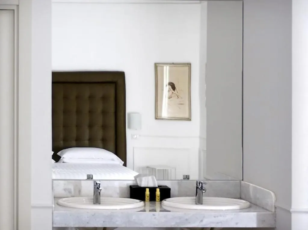 Bed in RAVIDA SUITES