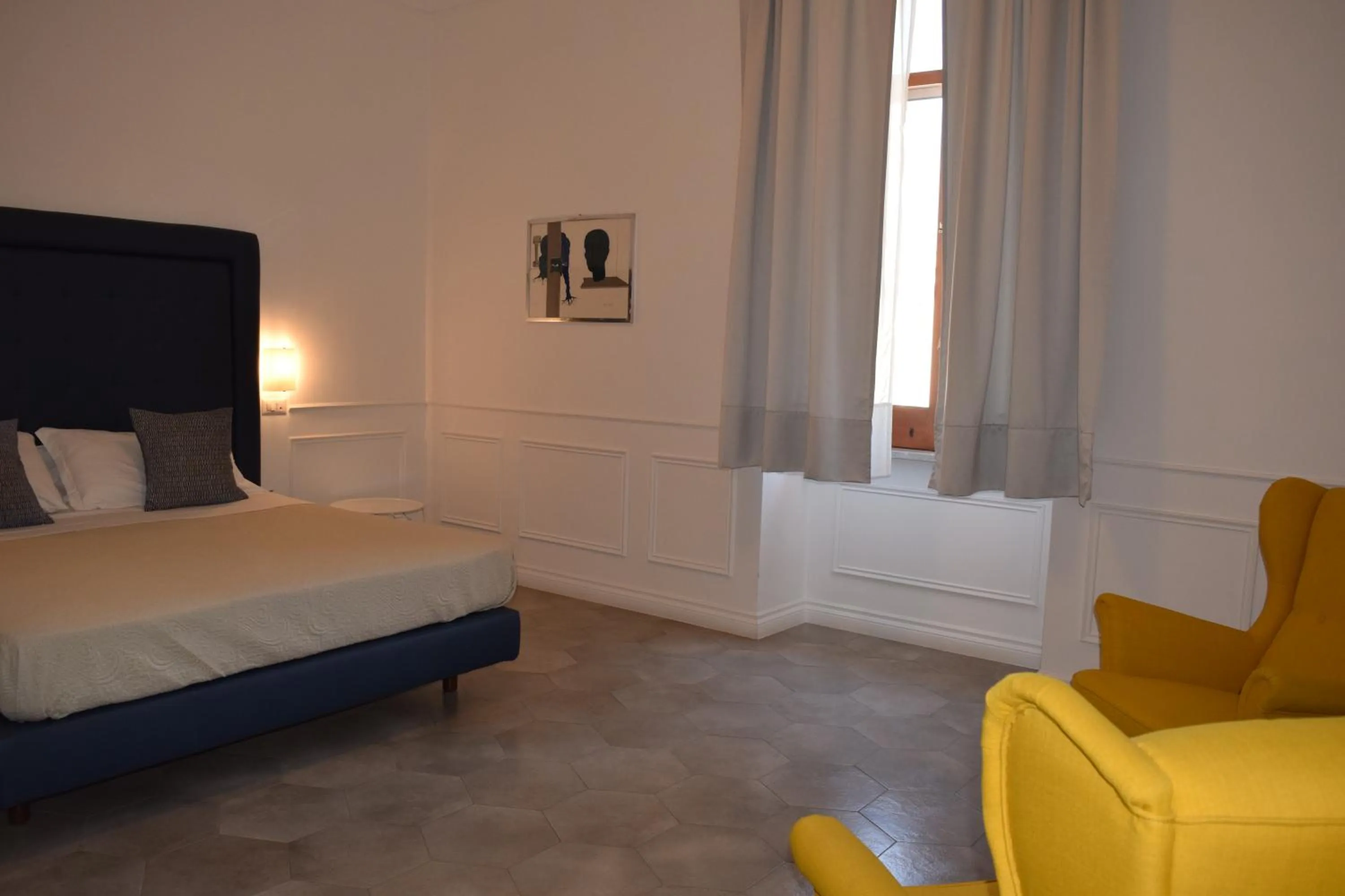 Bed in RAVIDA SUITES