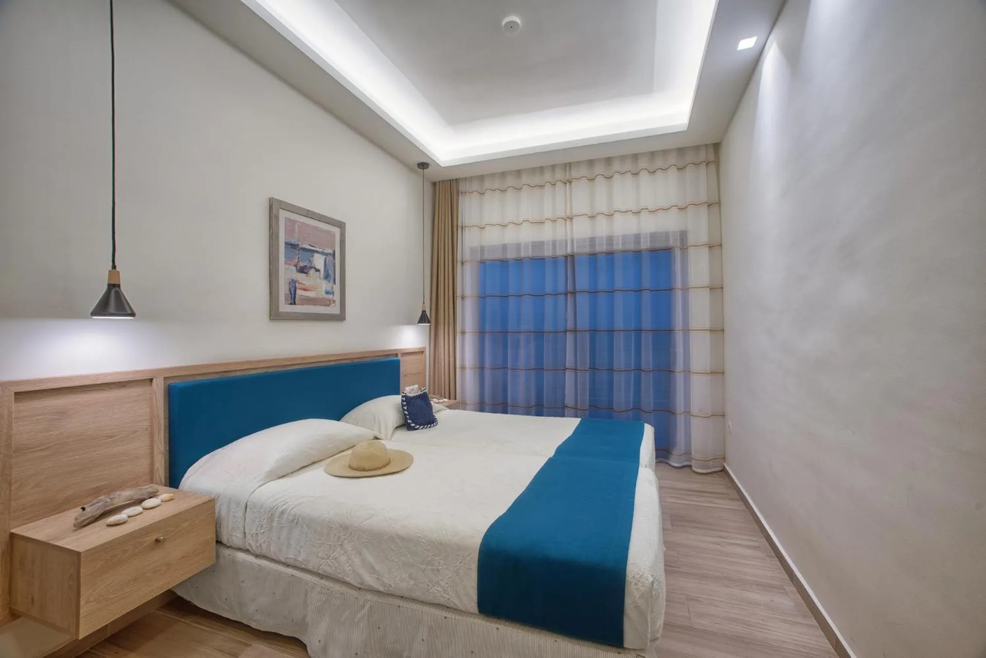 Bed in Cavos Bay Hotel & Studios