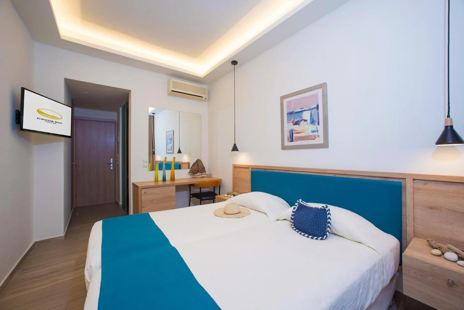 Bed in Cavos Bay Hotel & Studios