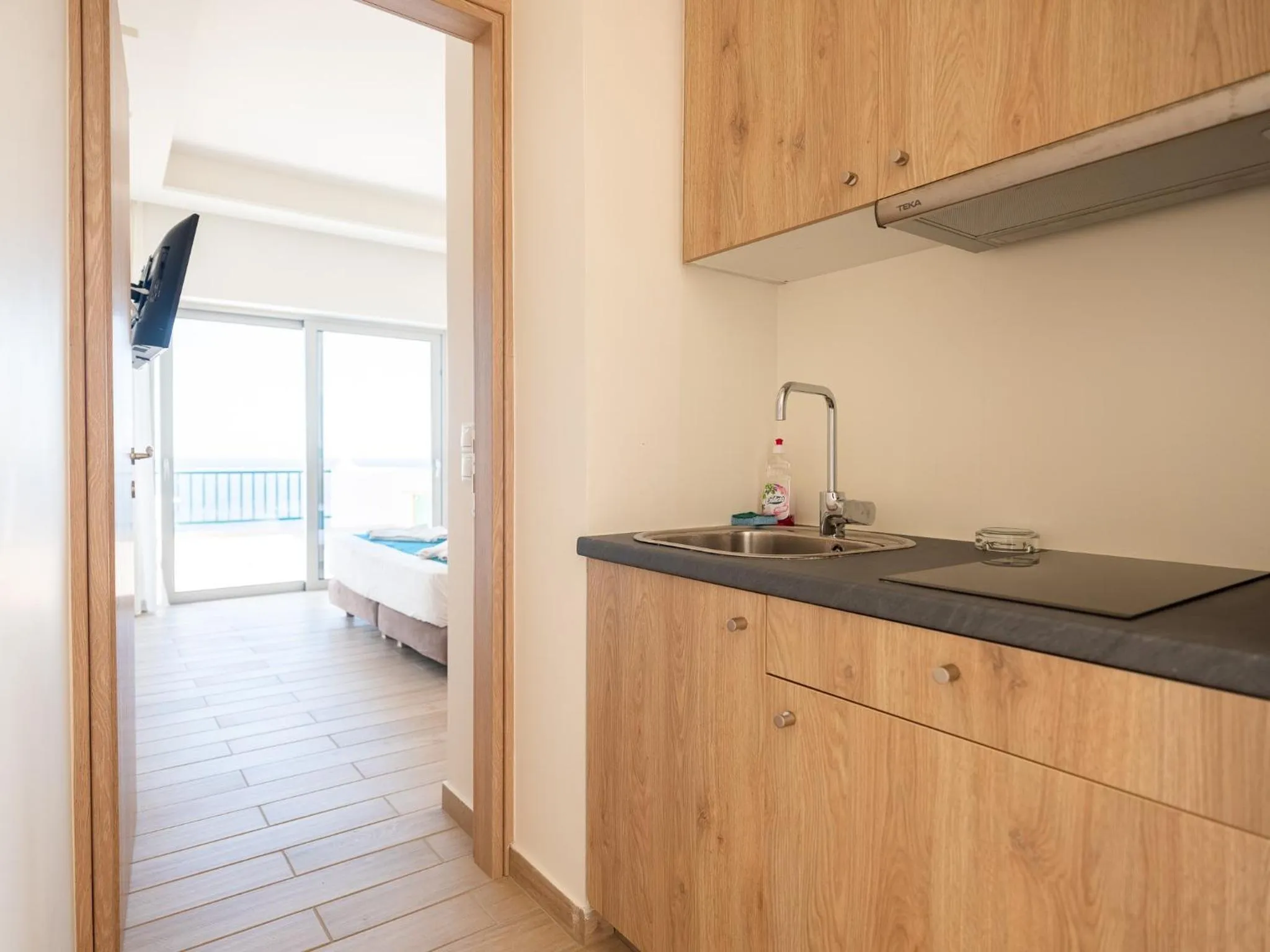 Kitchen or kitchenette in Cavos Bay Hotel & Studios