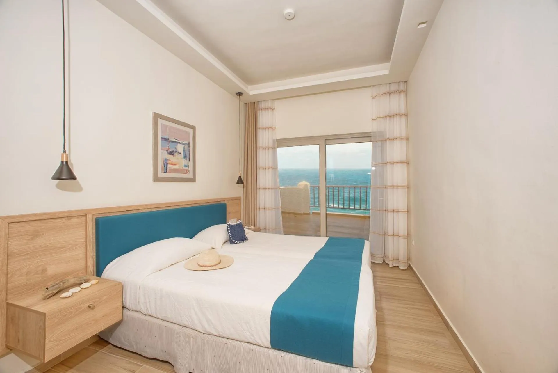 Bed in Cavos Bay Hotel & Studios