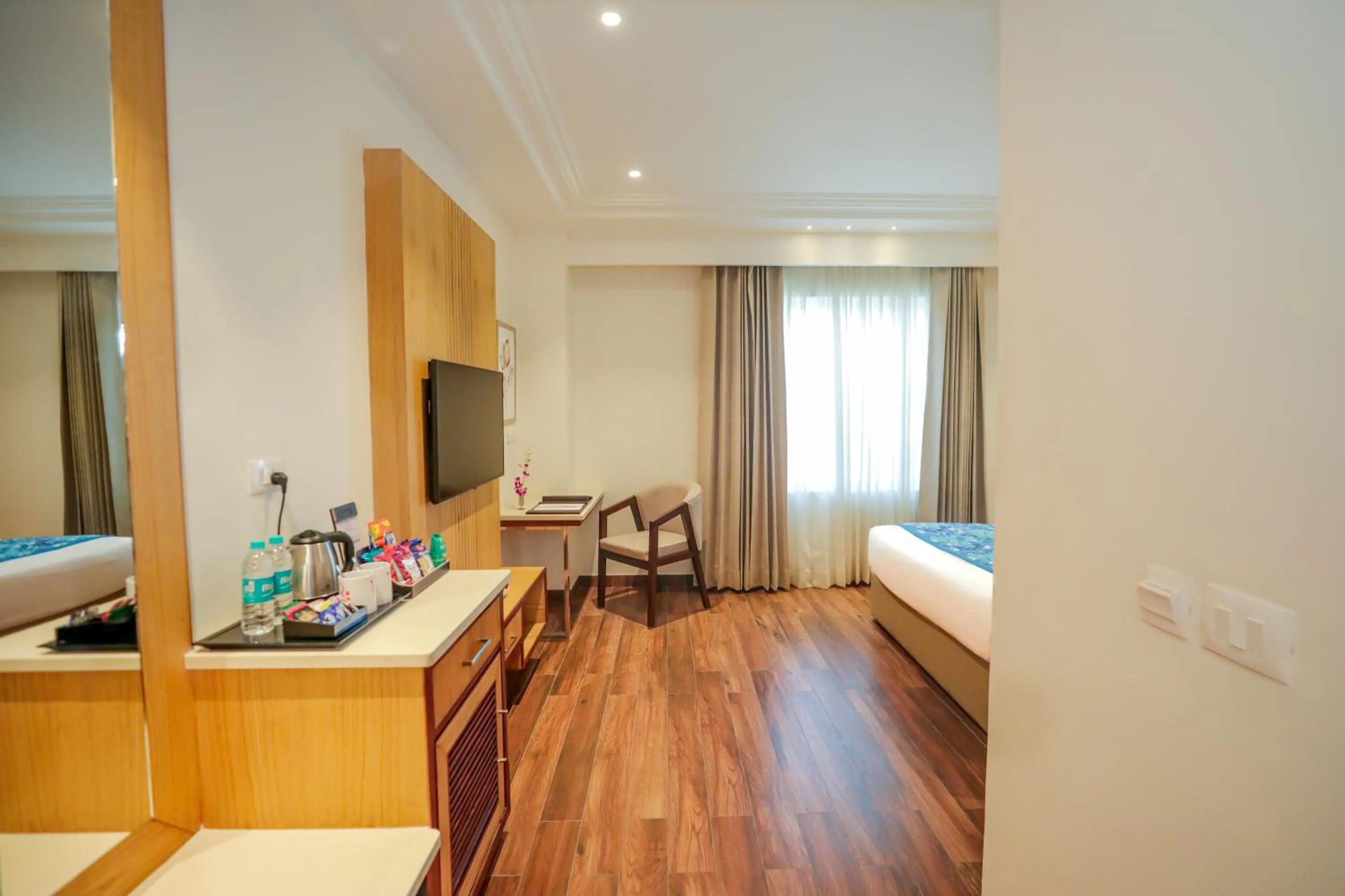 TV and multimedia, Bed in Regenta Place Phagwara by Royal Orchid Hotels Limited