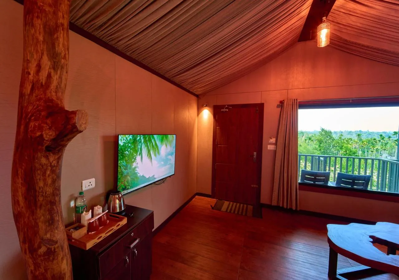 Communal lounge/ TV room in Niyatma Wayanad Pool Resort by VOYE HOMES - Inside Coffee Plantation