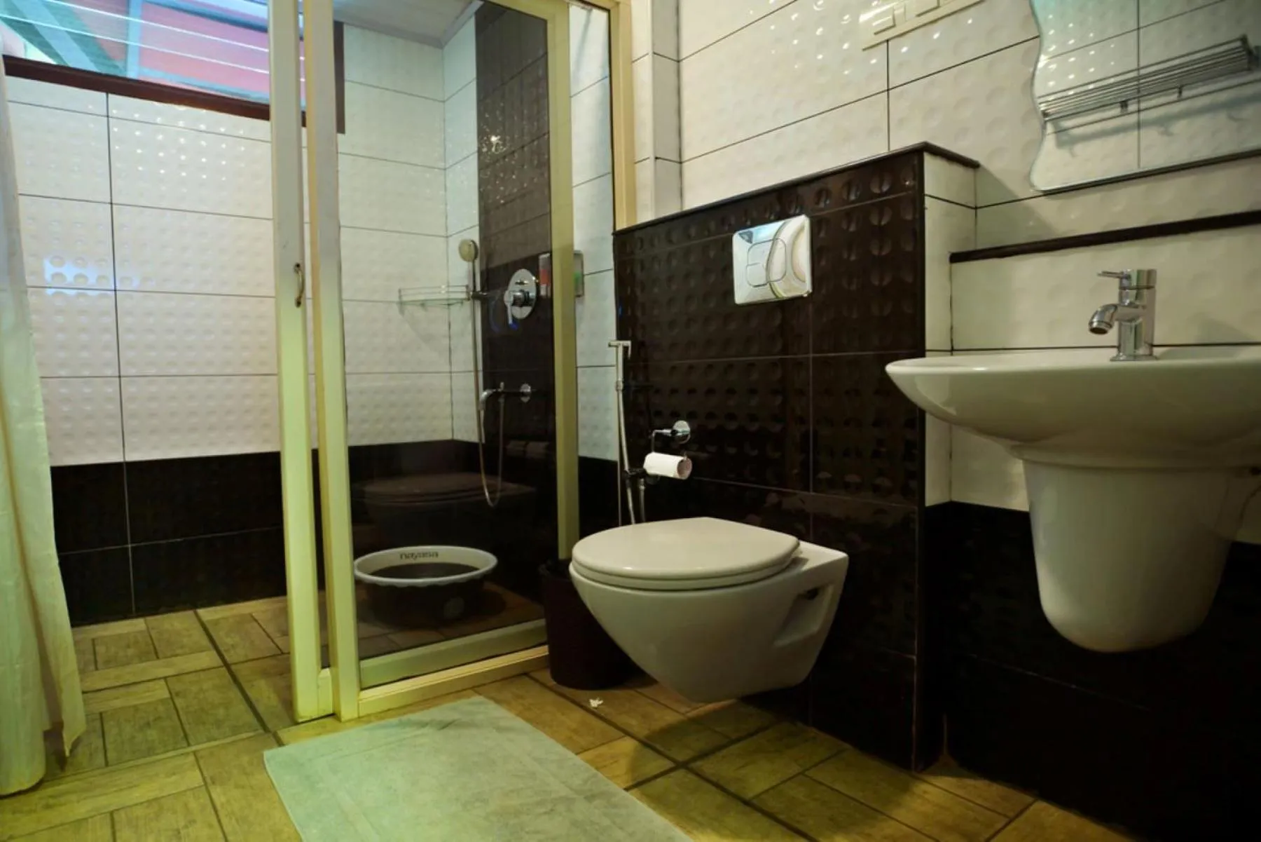 Shower in Niyatma Wayanad Pool Resort by VOYE HOMES - Inside Coffee Plantation