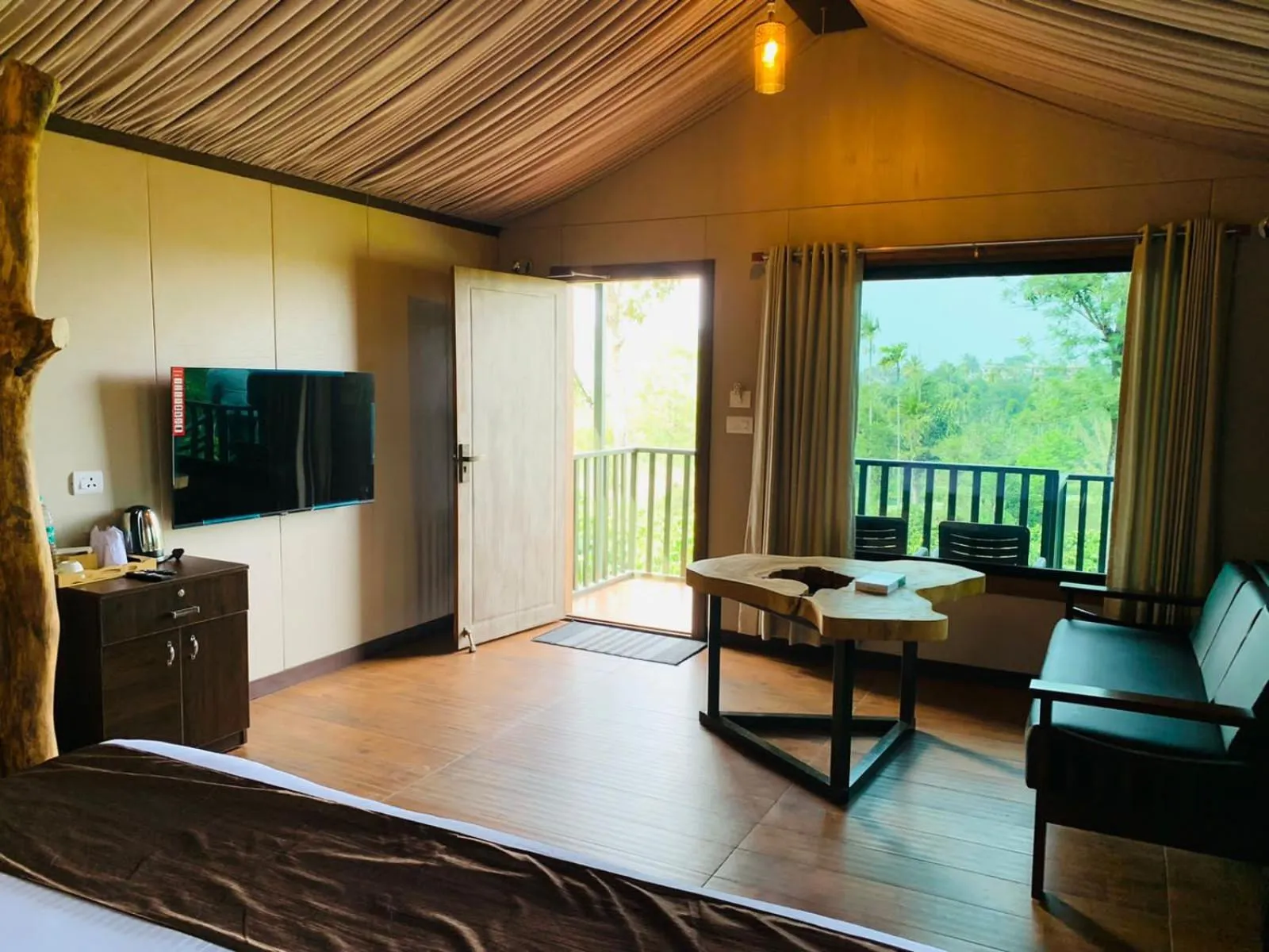 TV and multimedia in Niyatma Wayanad Pool Resort by VOYE HOMES - Inside Coffee Plantation