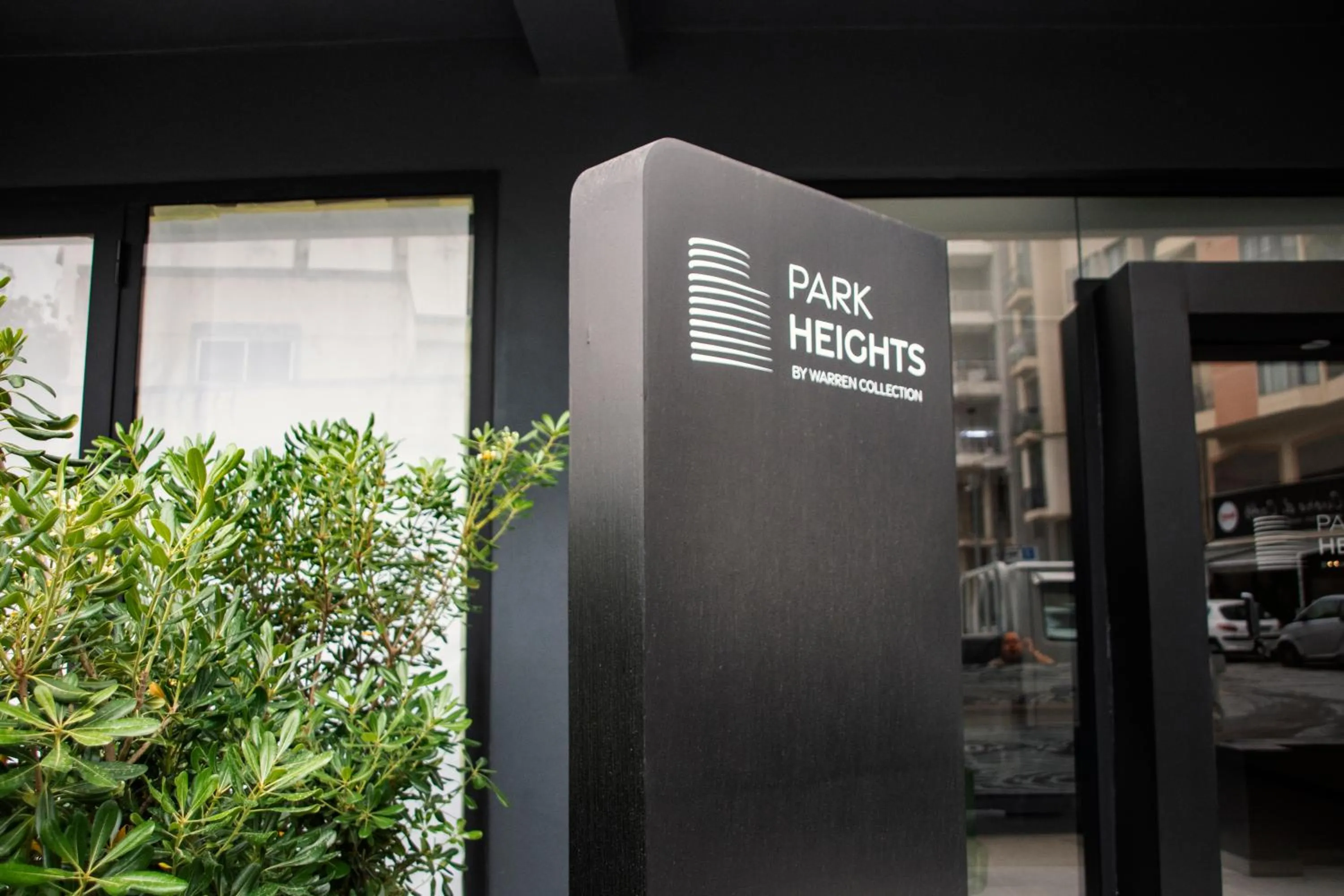 Property logo or sign in Park Heights by the Warren Collection