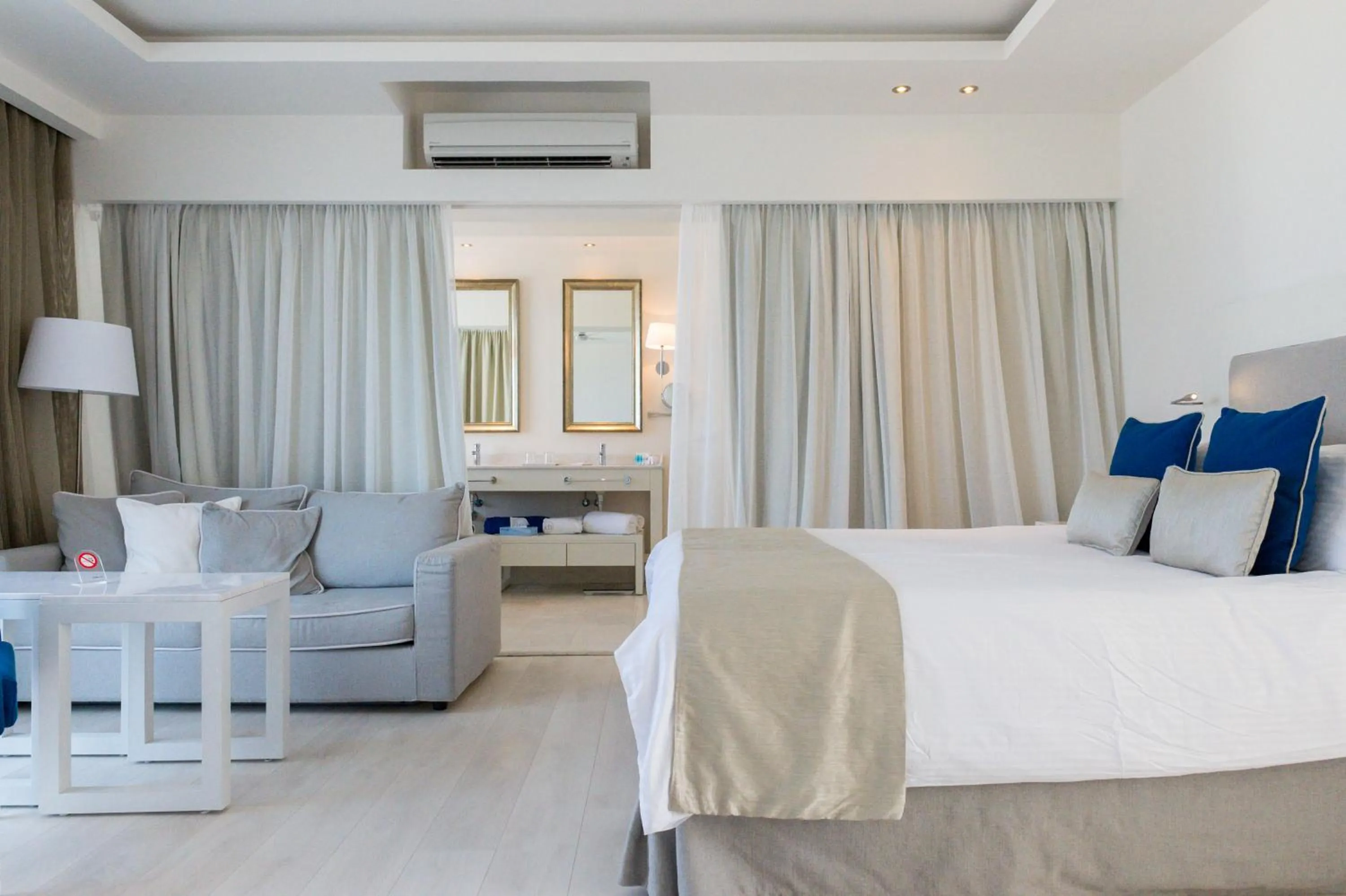 Bed in Knossos Beach Bungalows Suites Resort & Spa