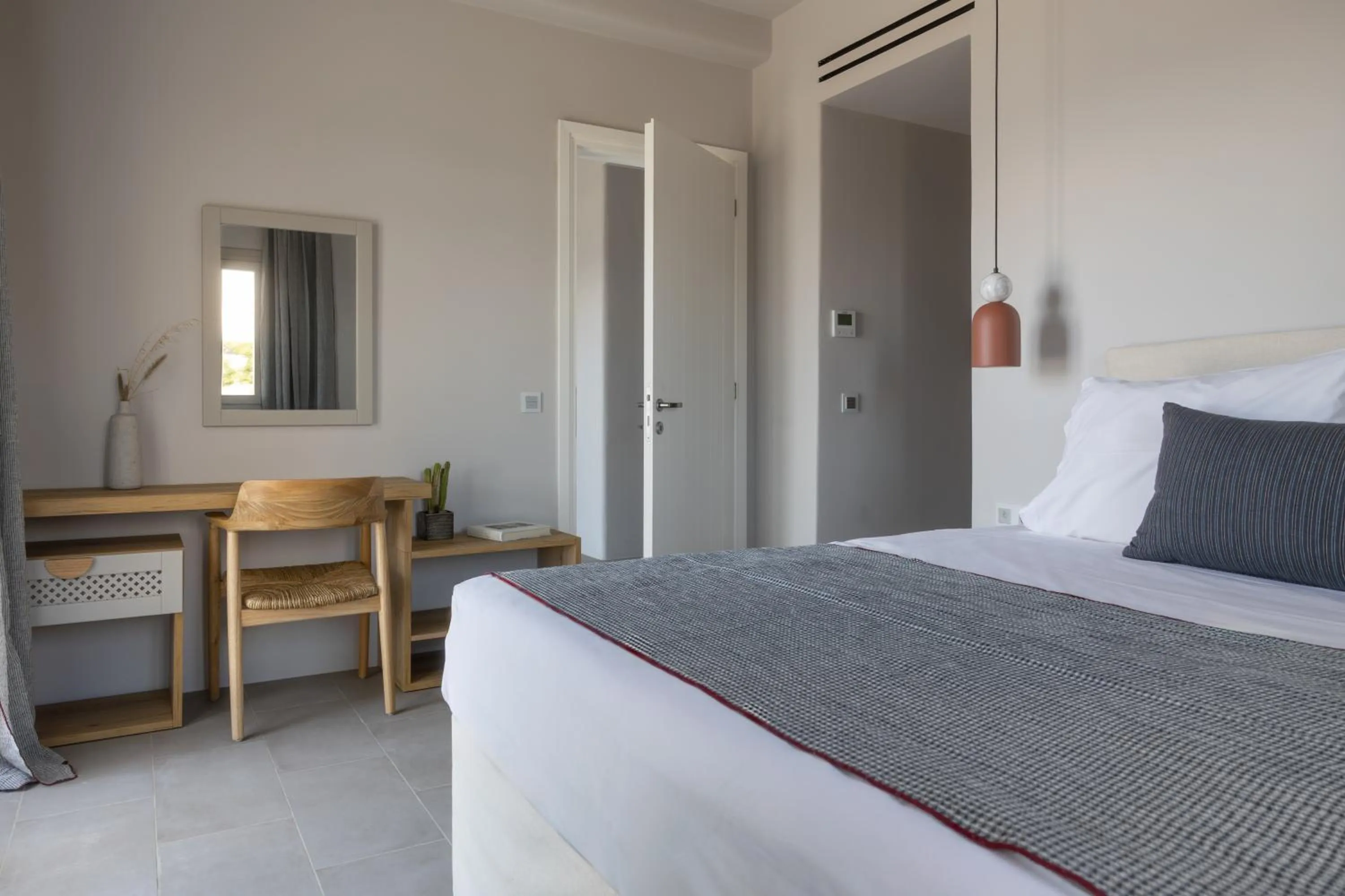 Bed in Poseidon of Paros Hotel & Spa