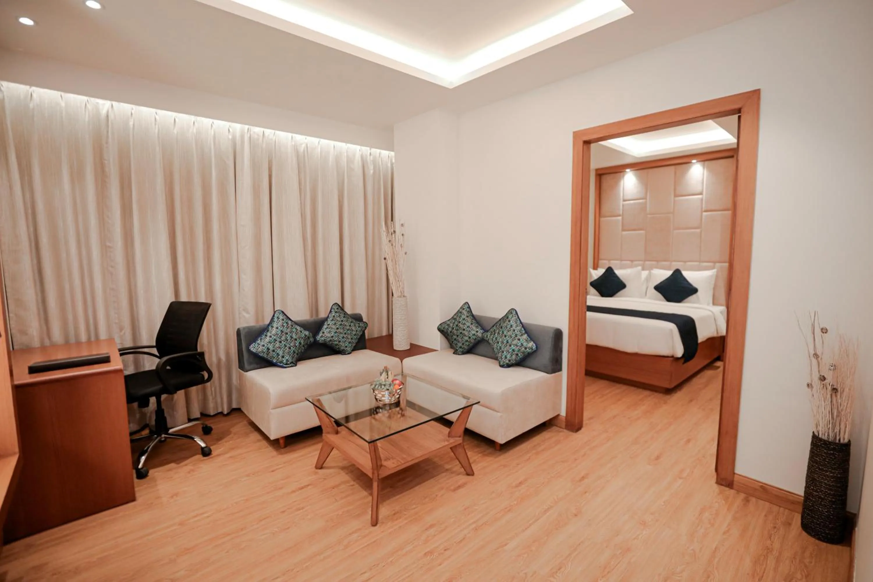 Living room, Bed in Regenta Place Bhopal by Royal Orchid Hotels Limited