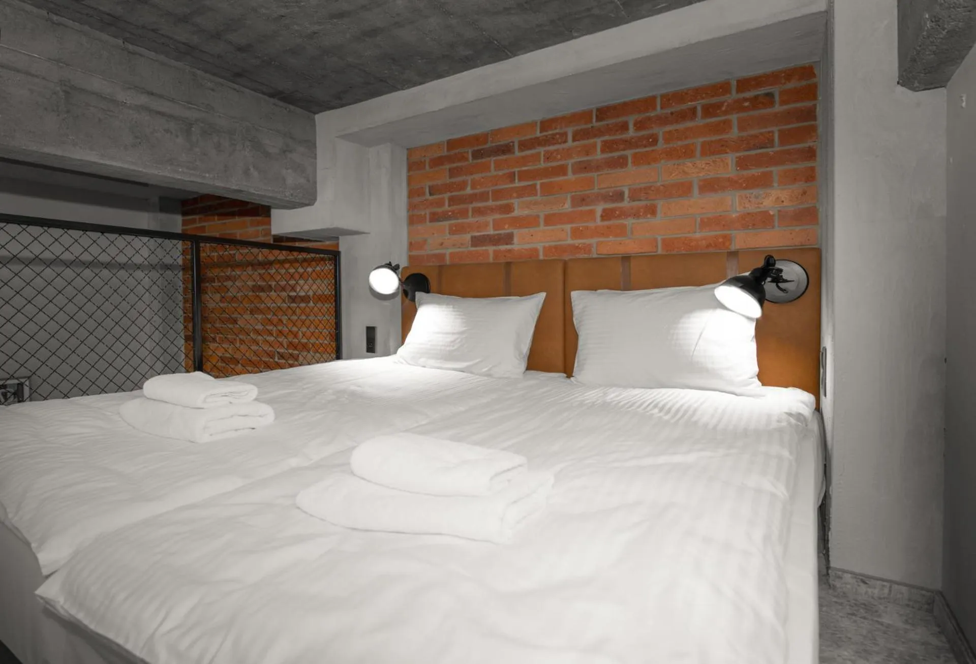 Bed in MONTOWNIA Lofts & Experience