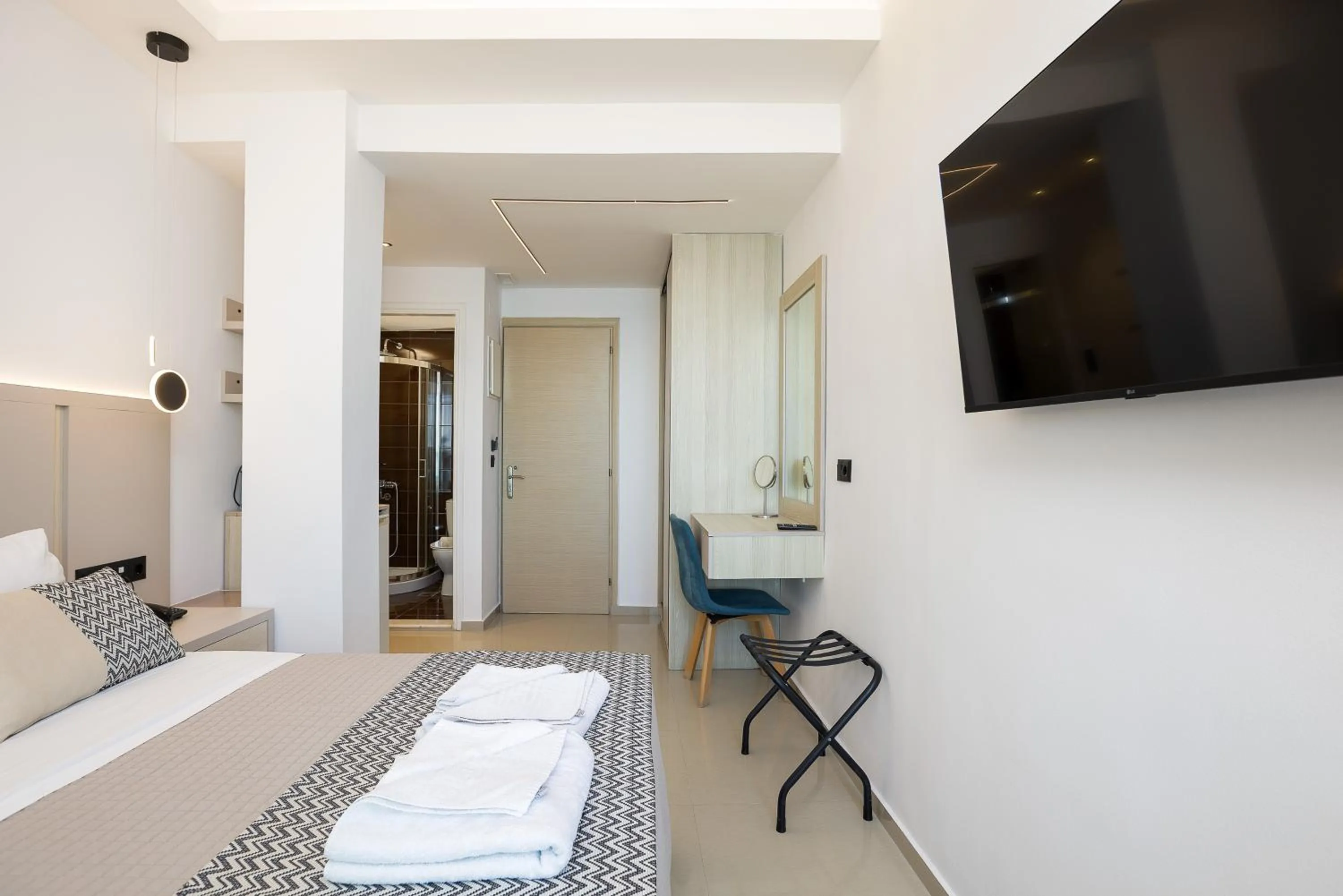 Bed in Poseidon Hotel