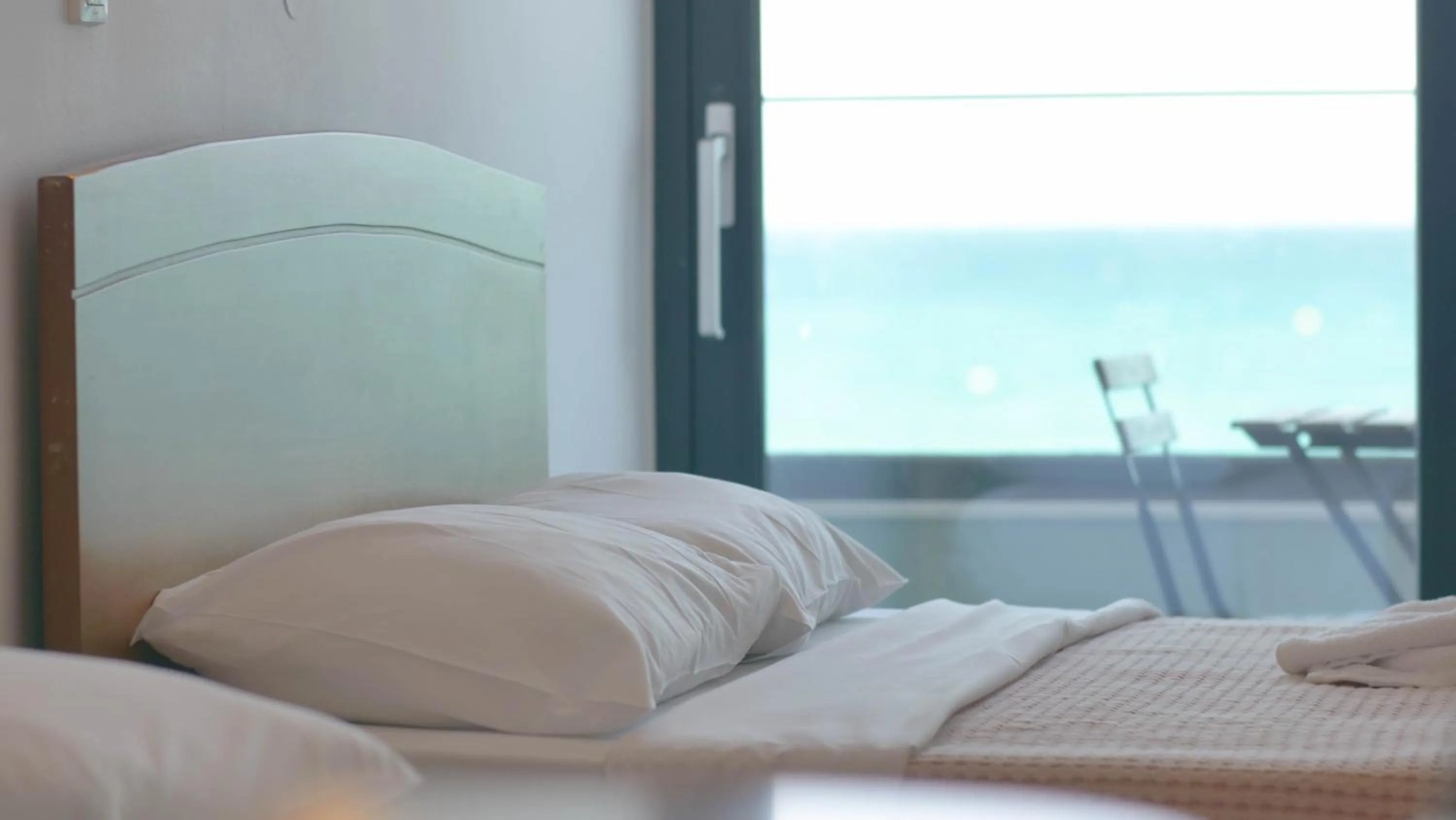 Bed in Poseidon Hotel