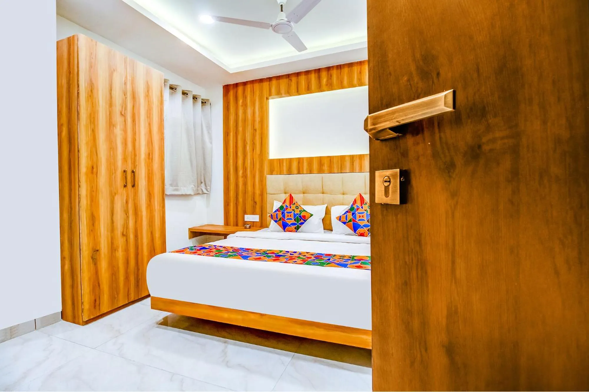 Bed in FabHotel Prime Purple Orchid