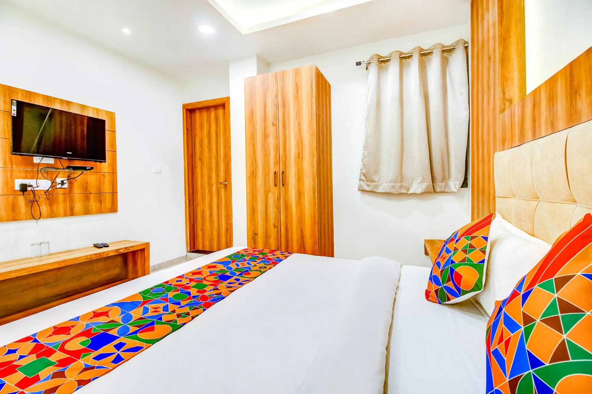 Bed in FabHotel Prime Purple Orchid