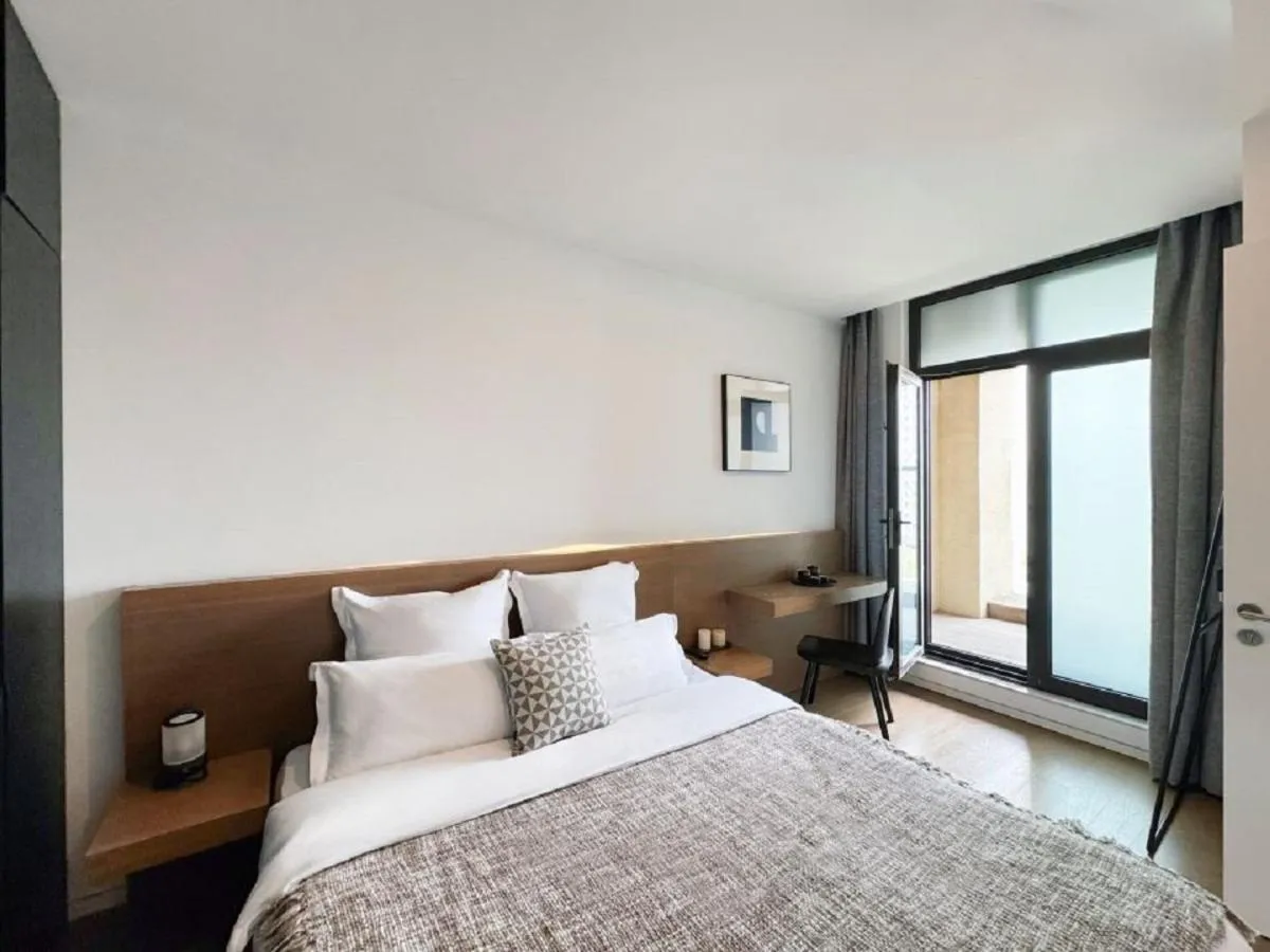 Bedroom in base-PUSAN Serviced Apartment -Shanghai New International Expo Centre
