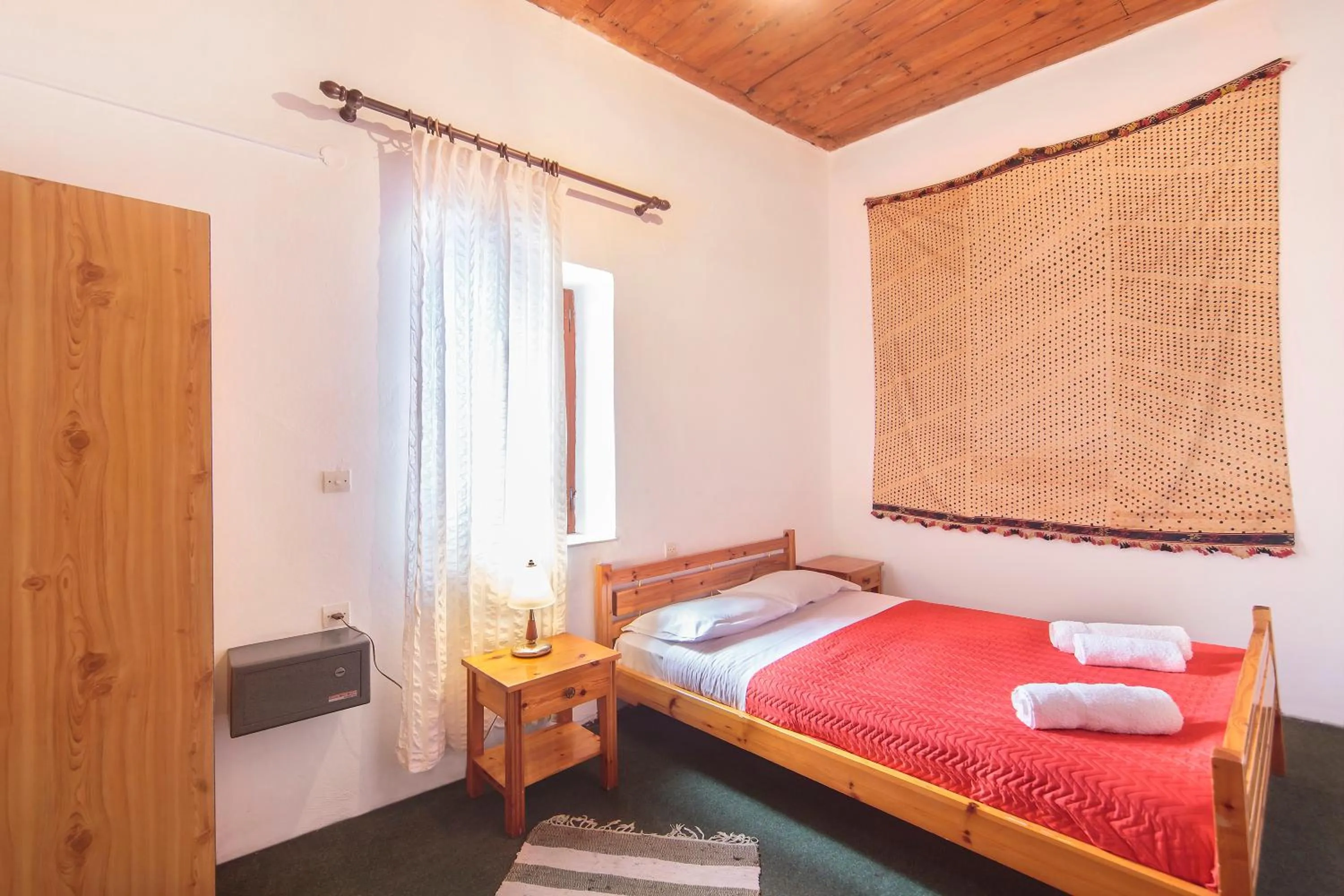 Bedroom in KasteliSuites