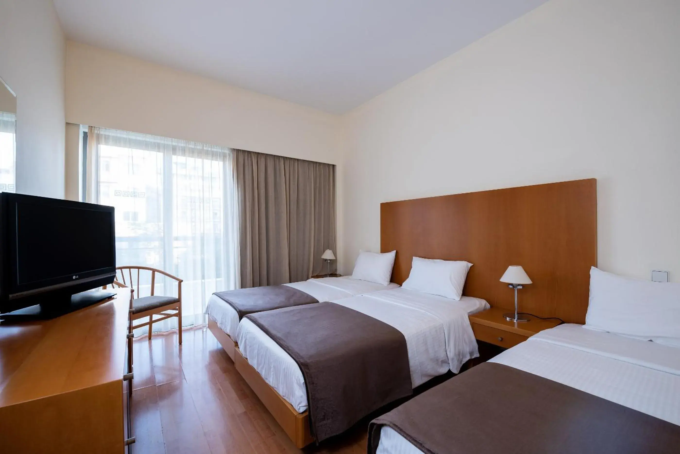 Triple Room in Angela Downtown Hotel Triple Room in Angela Downtown Hotel