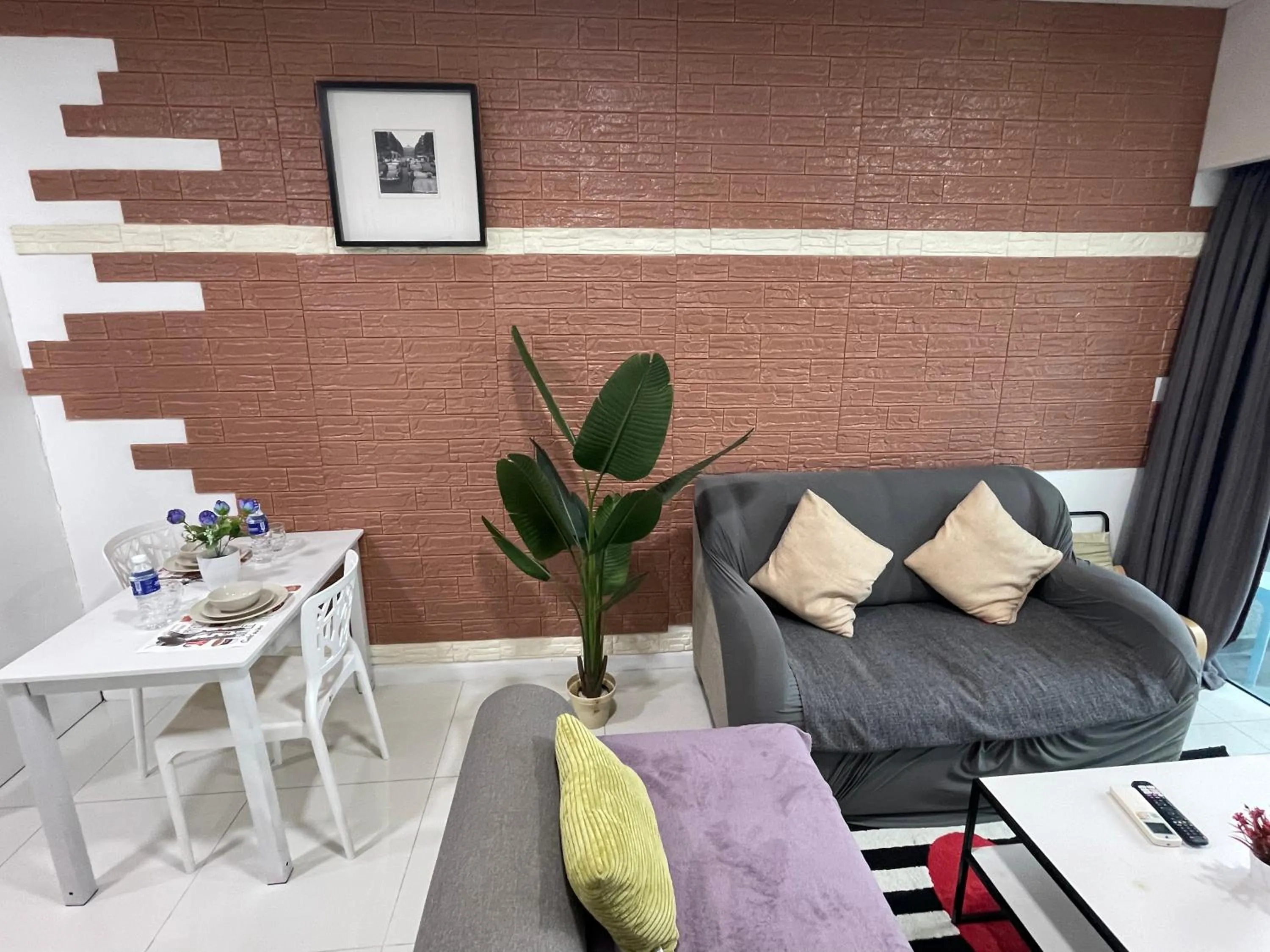 Seating area in Mercu Summer Suite KLCC by Minshuku