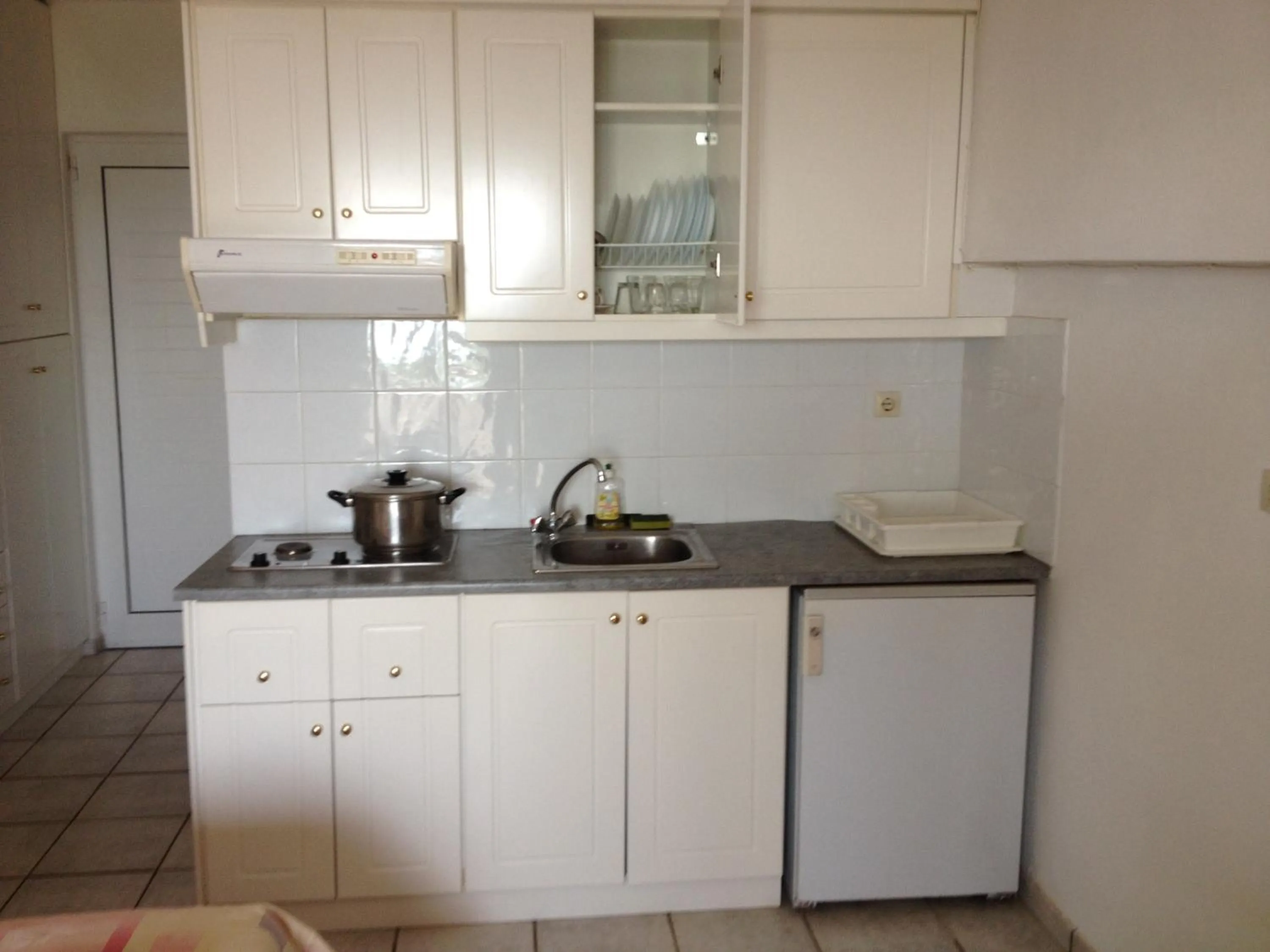 Kitchen or kitchenette in Gikas Apartments Triple Studio Sea View B7