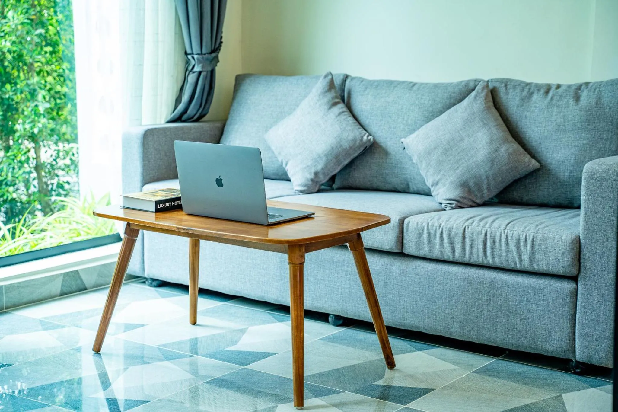 Seating area in Rainforest Hotel by NSUN