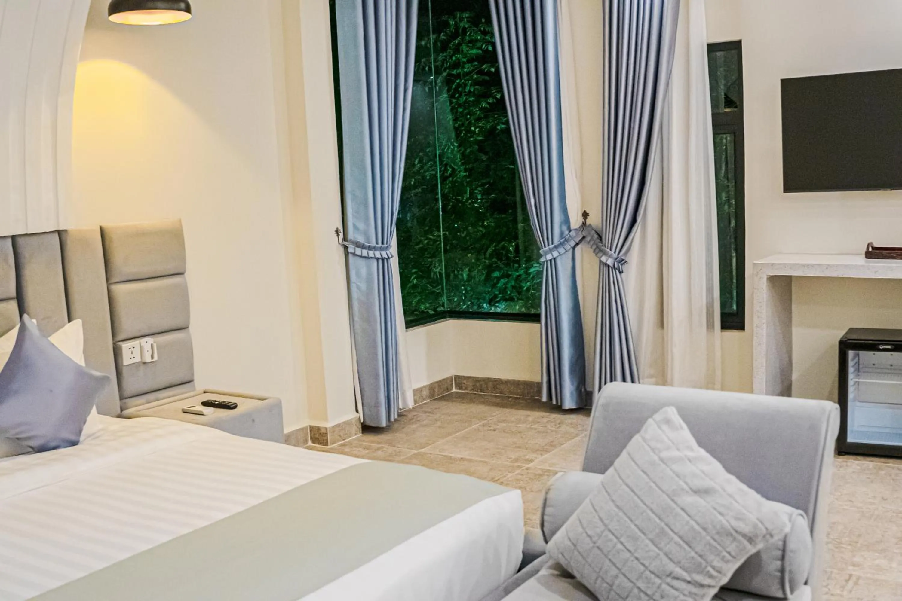 View (from property/room), Bed in Rainforest Hotel by NSUN