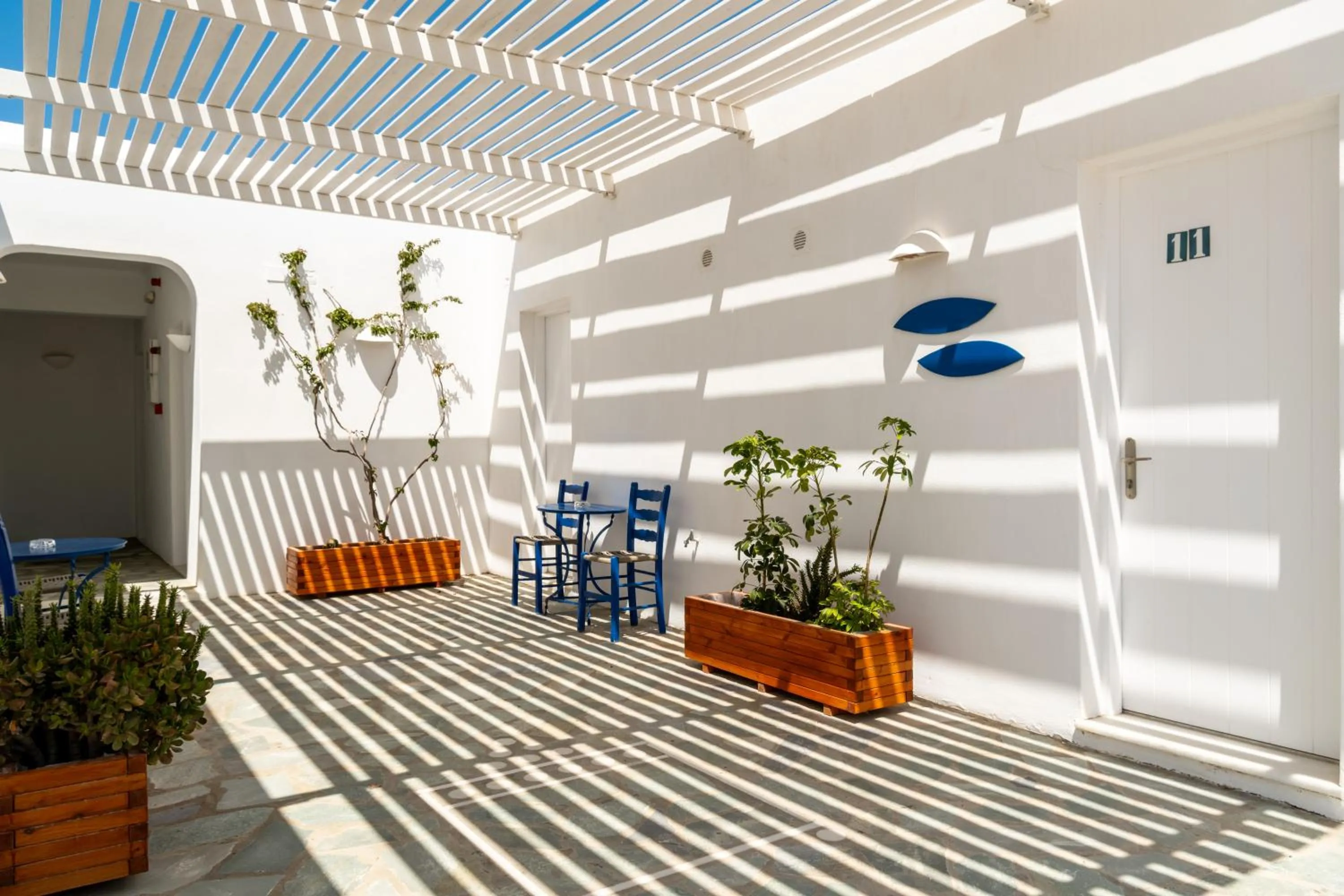 Property building in Naoussa Hotel Paros by Booking Kottas