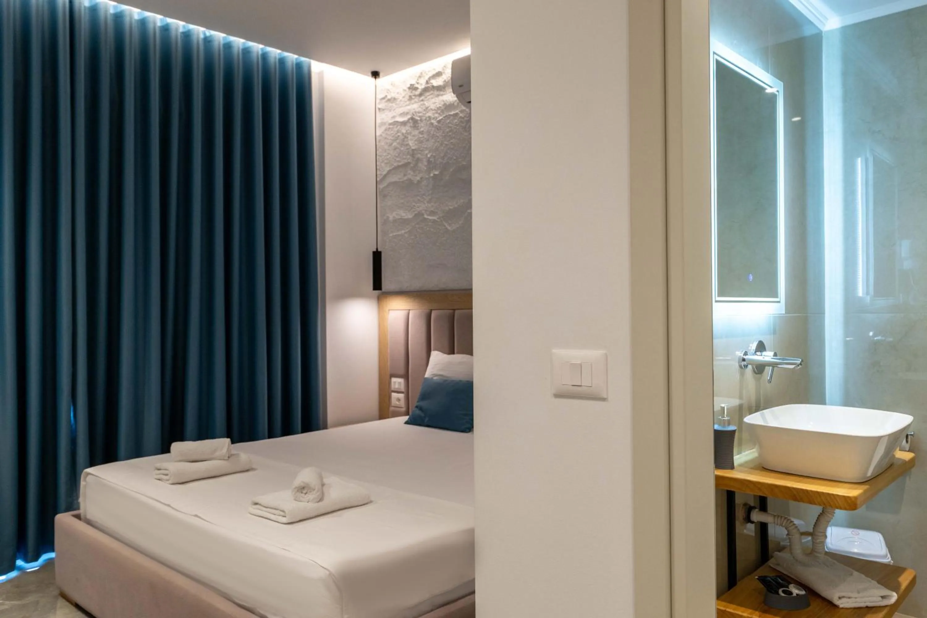 Toilet, Bed in Monel Hotel