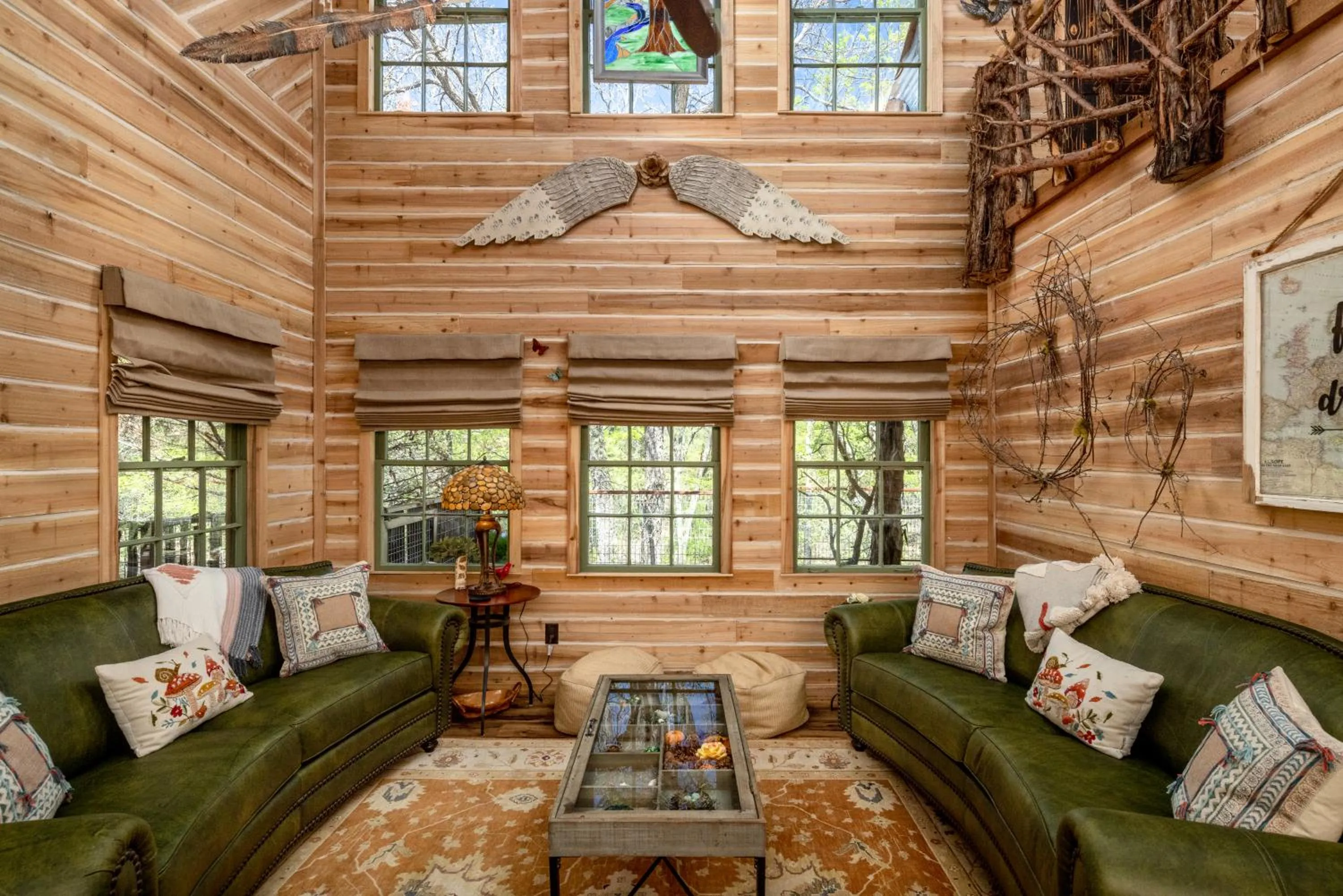 Living room in "Magical Treehouse" w spiral slide off the deck 350 acres on the Brazos River! Tubing! Petting Zoo!