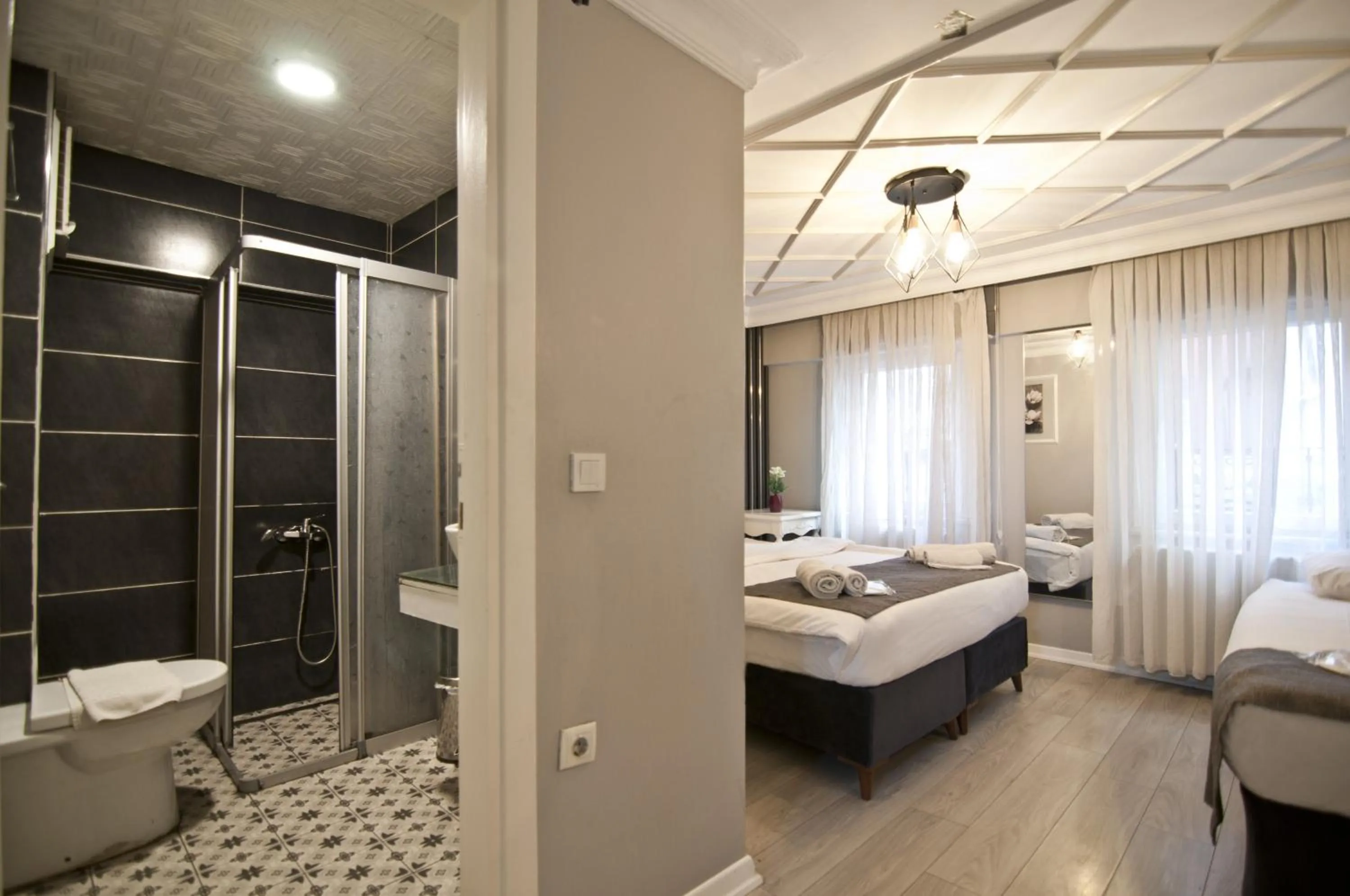 Shower, Bed in Nova City Hotel