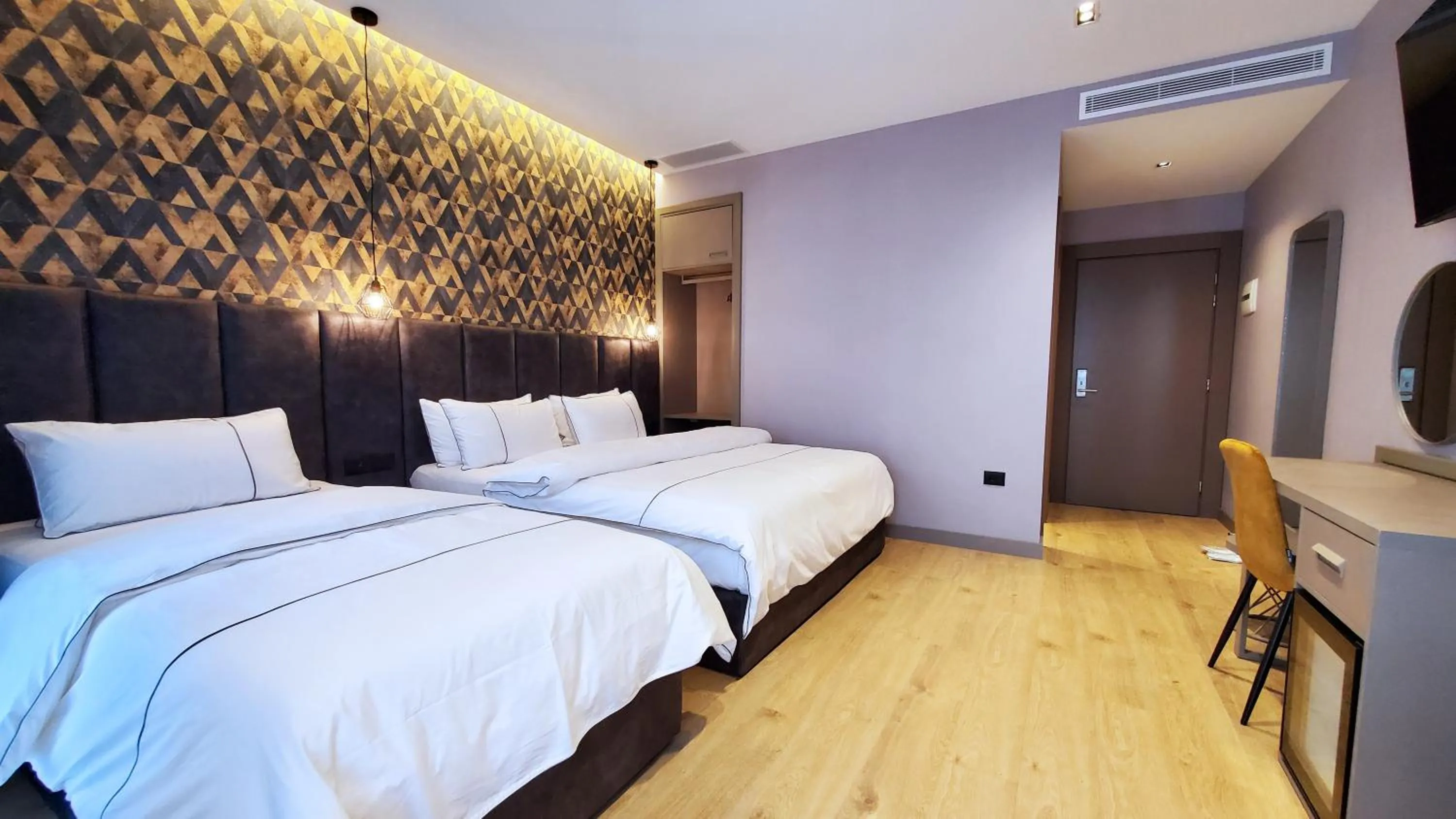 Bed in StarLight Hotel