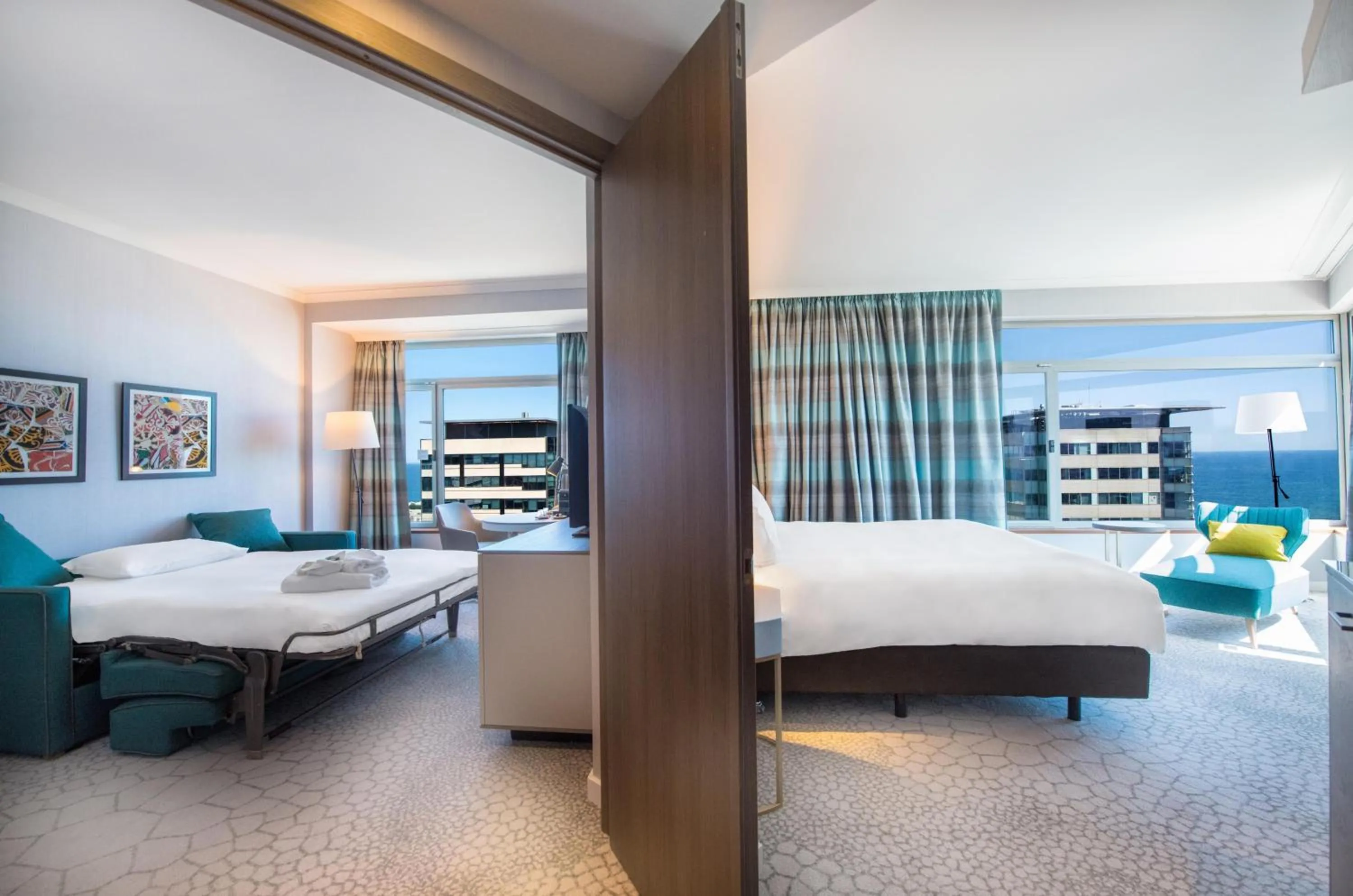 Living room, Bed in Hilton Diagonal Mar Barcelona