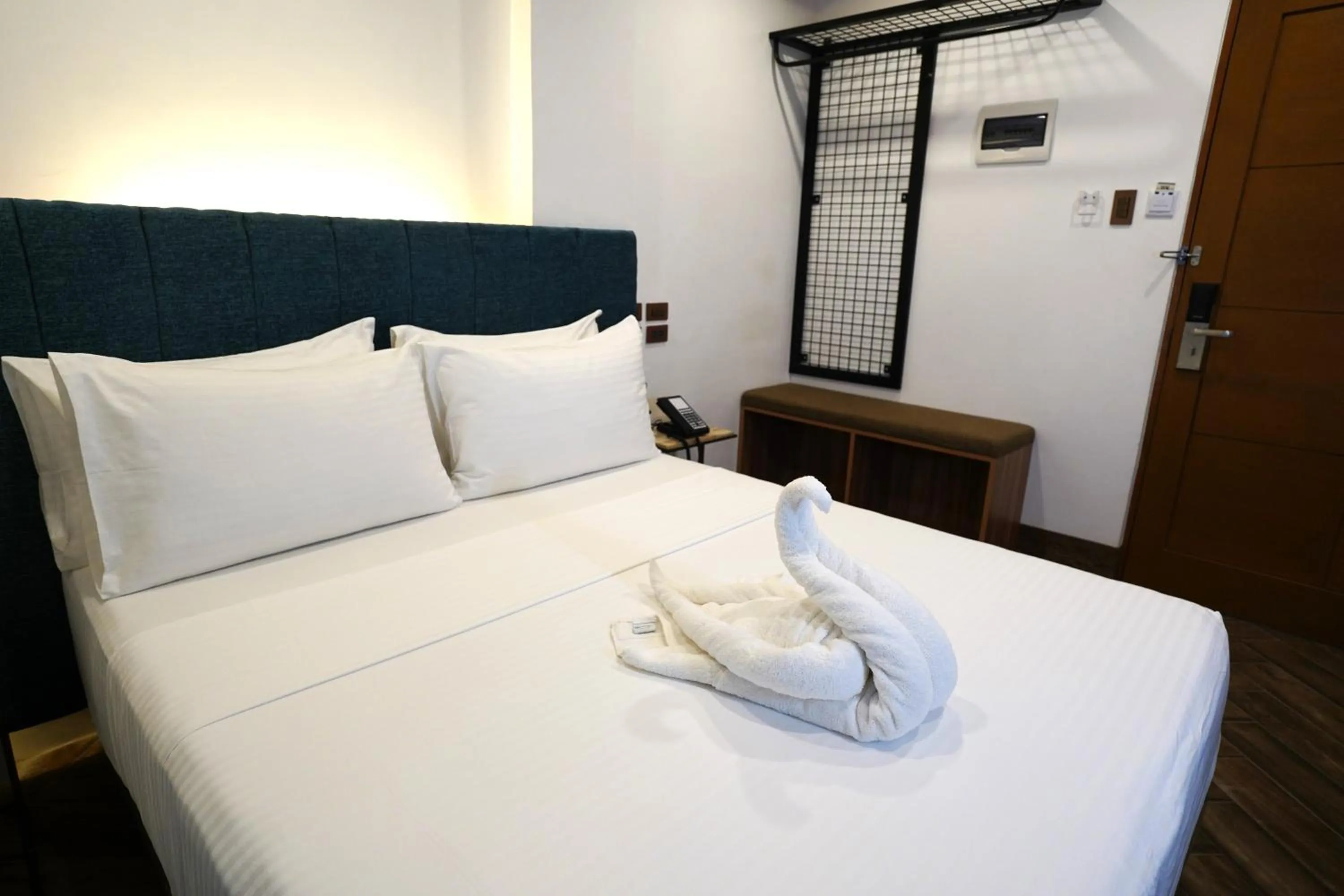 Bed in Lighthouse Point Hotel