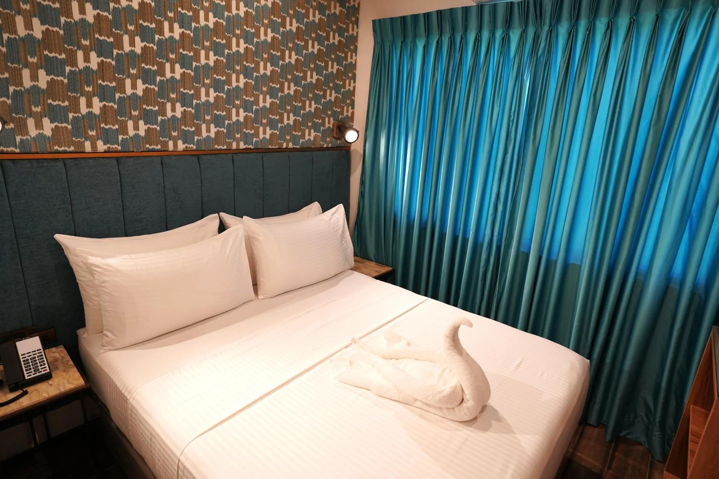 Bed in Lighthouse Point Hotel