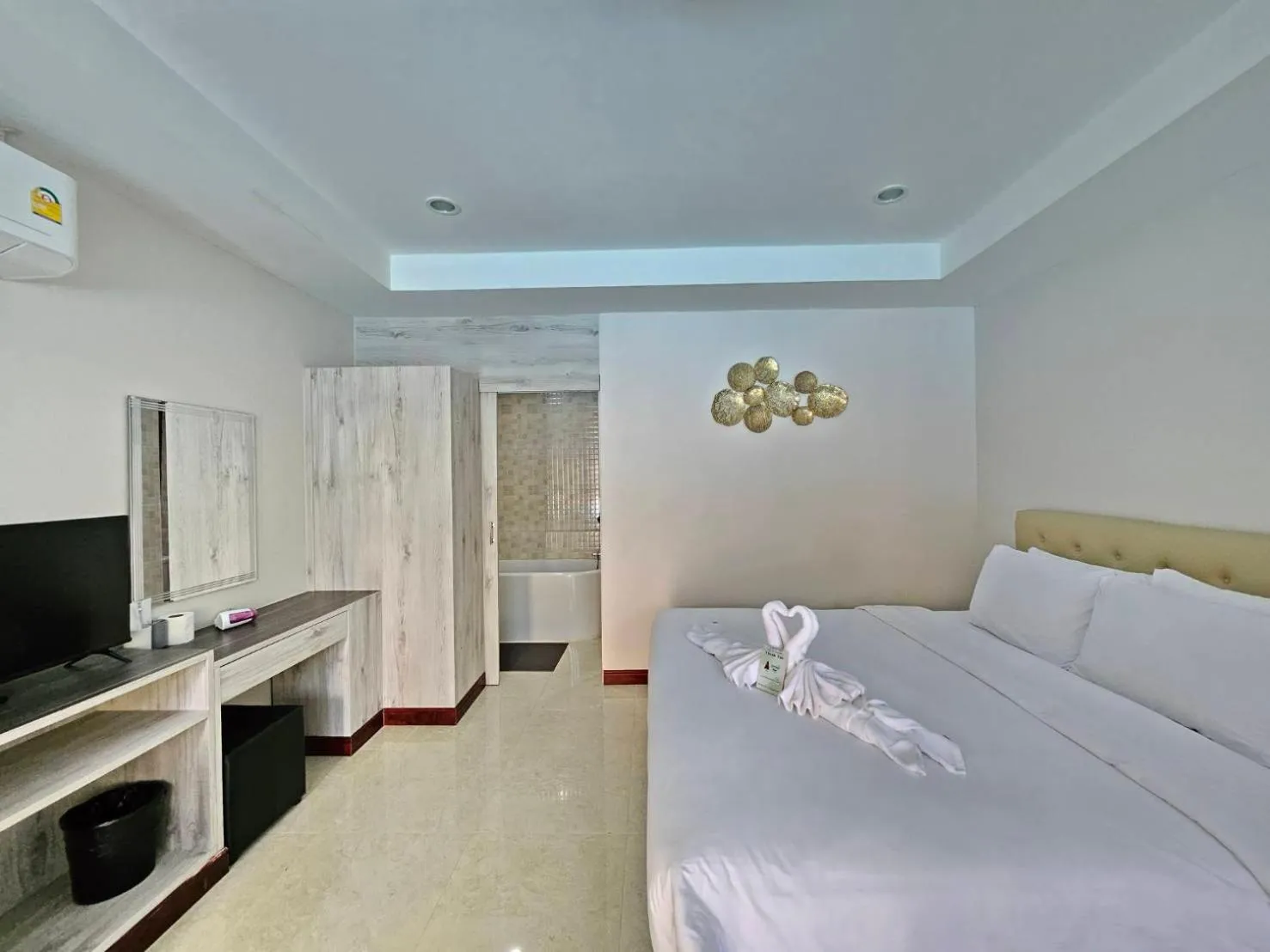 Bed in CottagePine Rayong Resort&Cafe