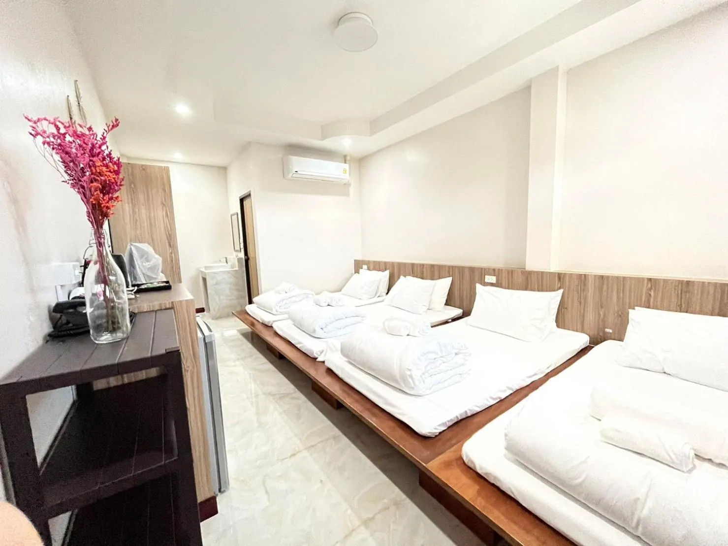 Bed in CottagePine Rayong Resort&Cafe