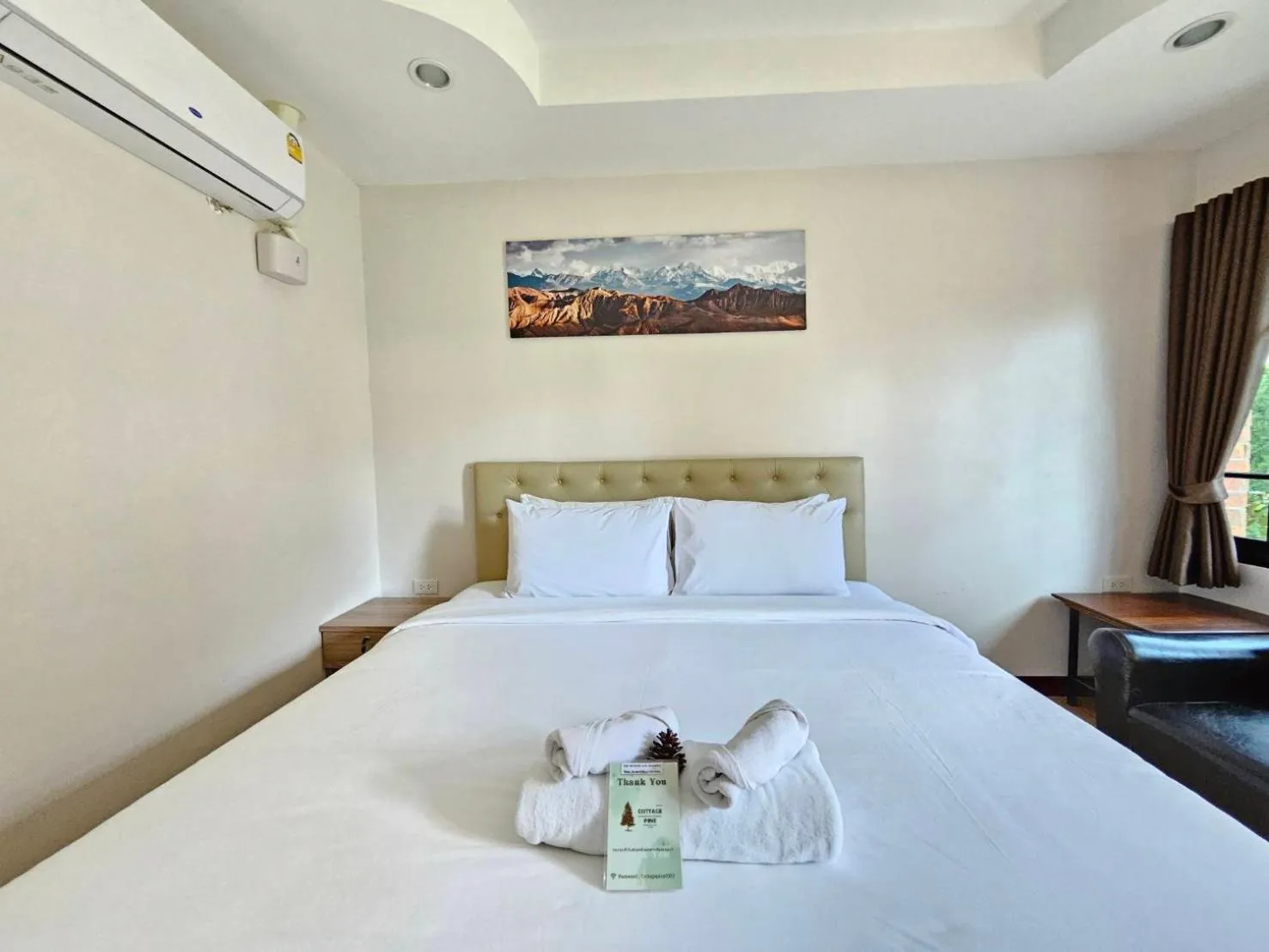 Bed in CottagePine Rayong Resort&Cafe