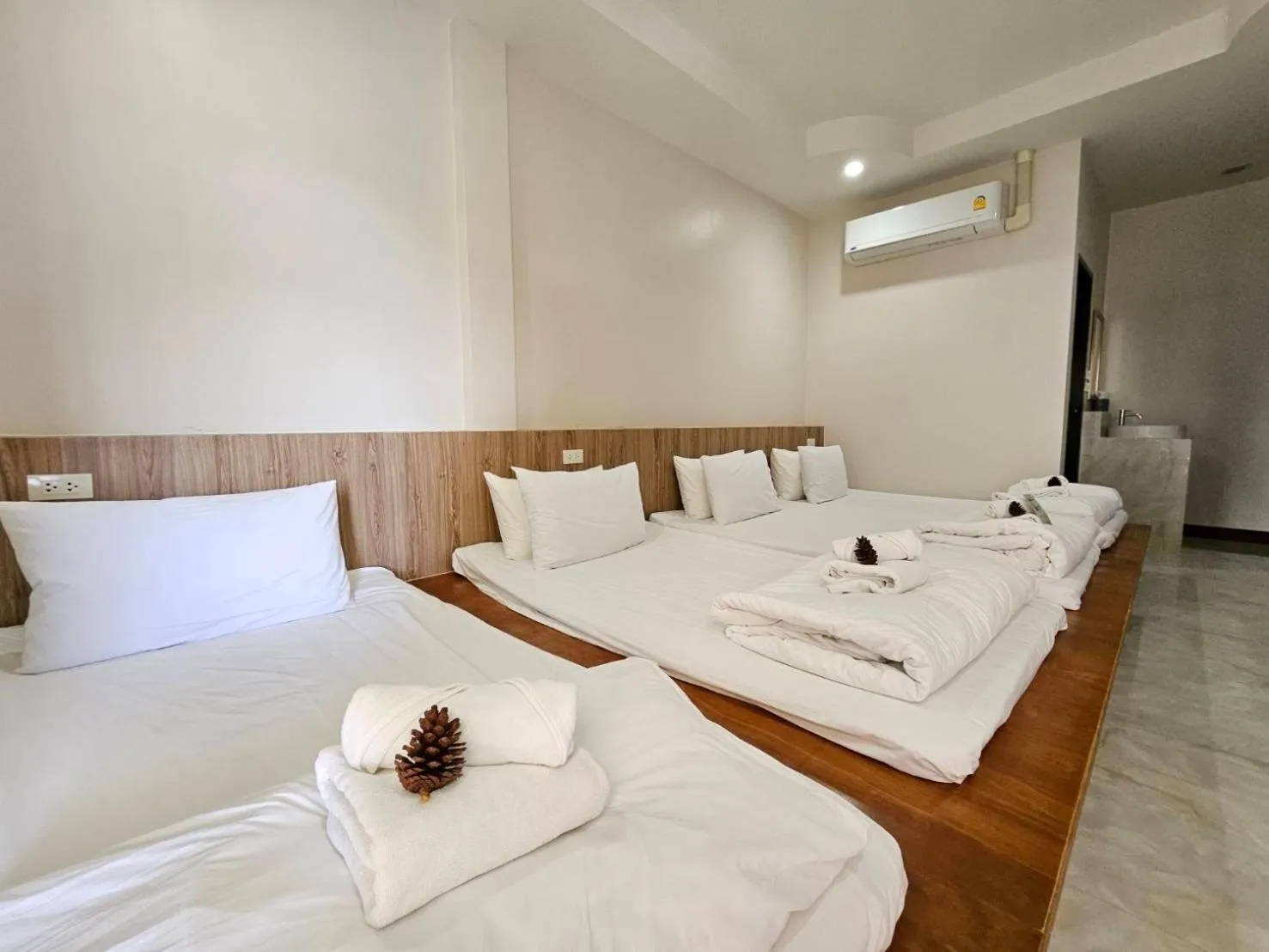 Bed in CottagePine Rayong Resort&Cafe