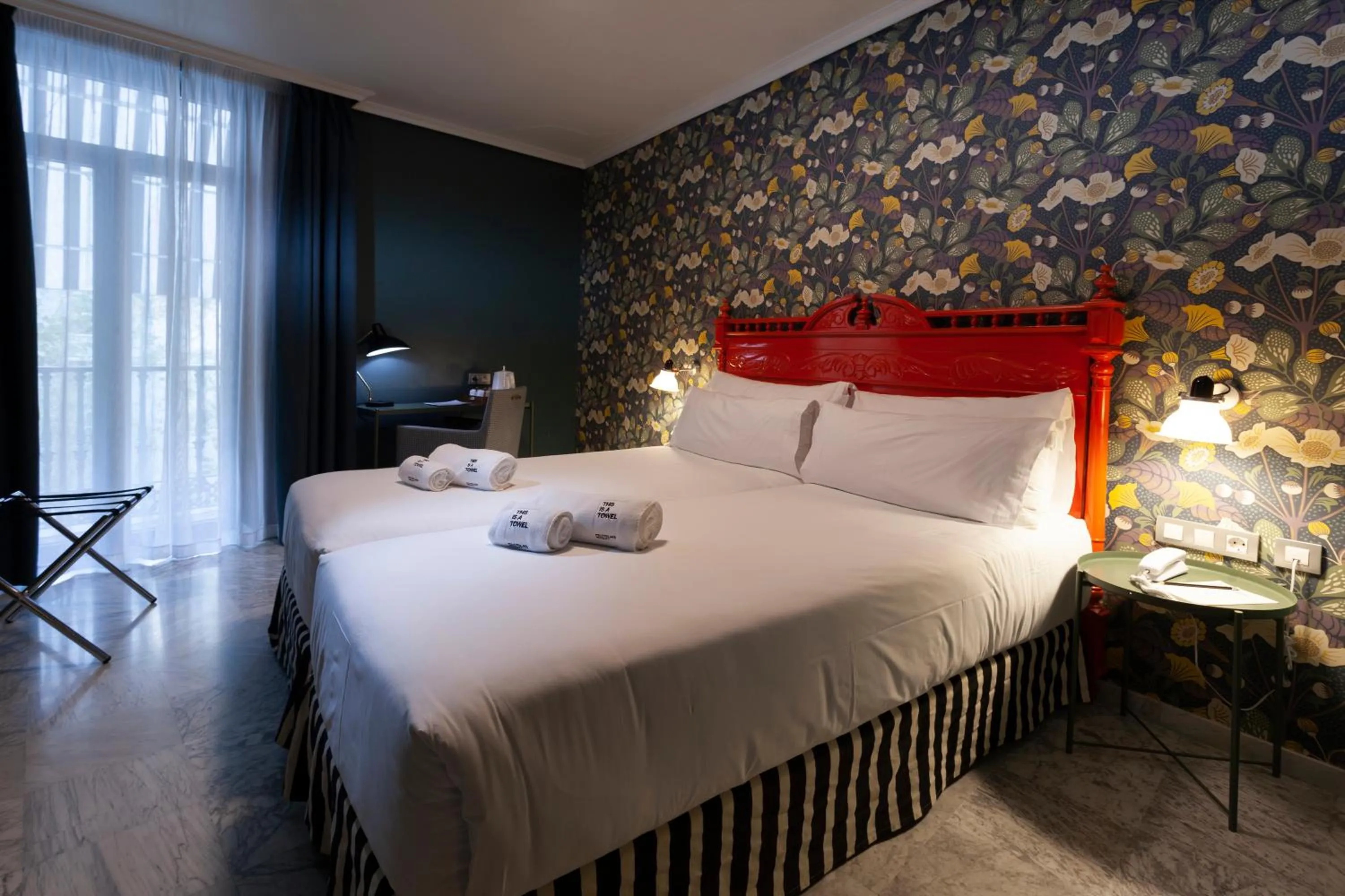 Bed in Petit Palace Puerta de Triana