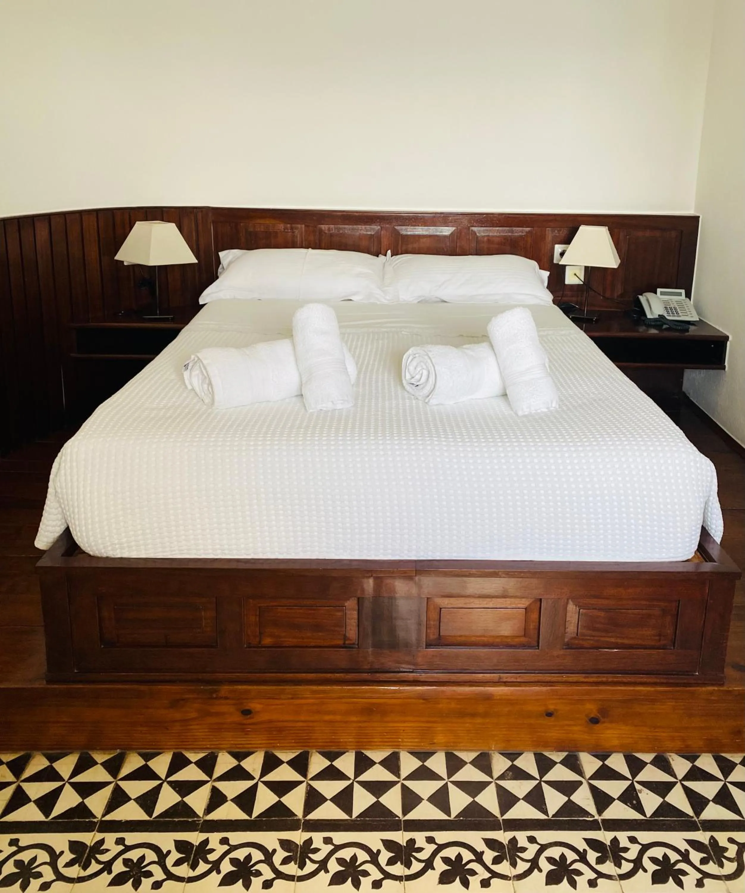 Bed in Palazzo Arhontiko Apartments