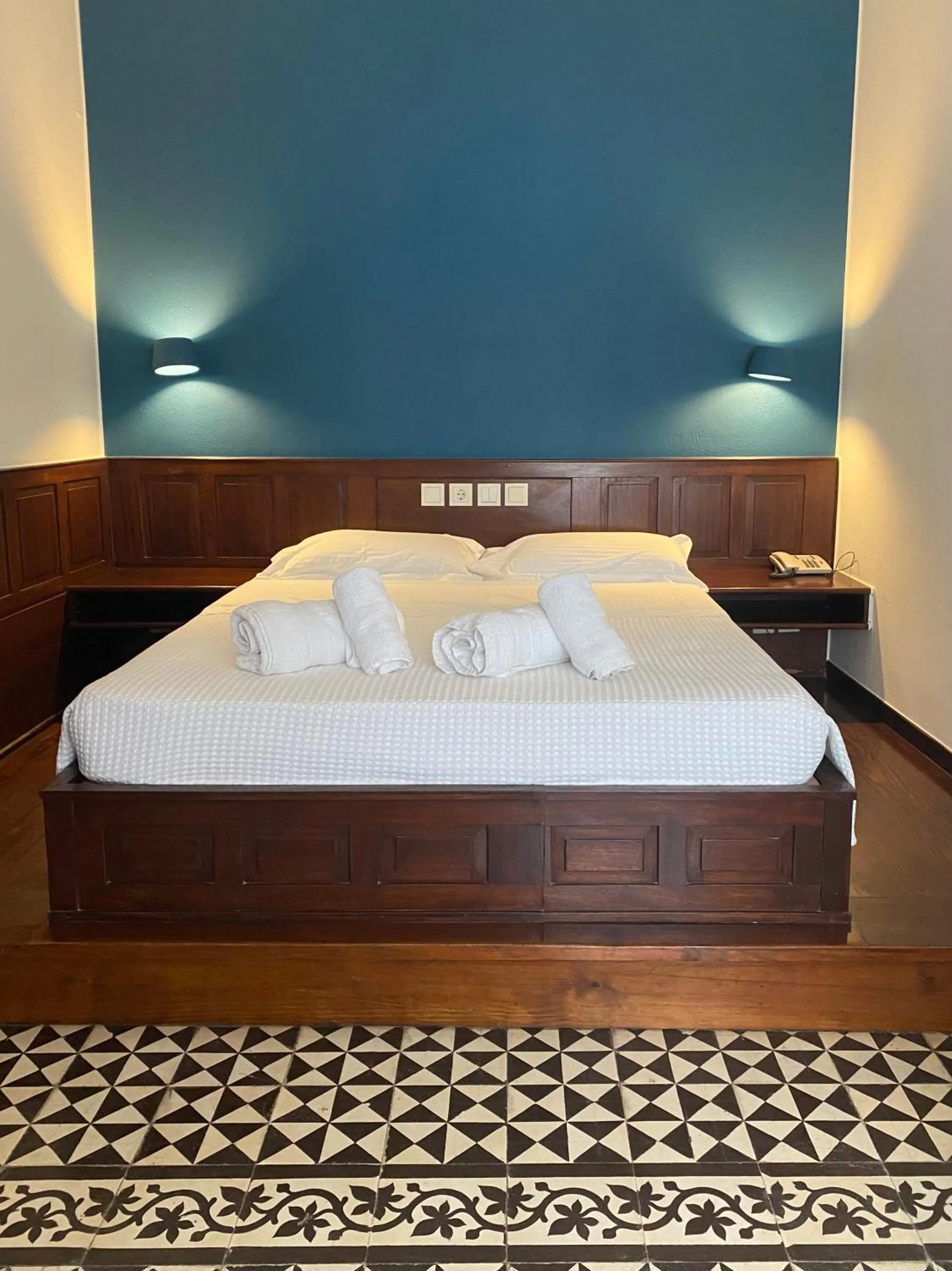 Bed in Palazzo Arhontiko Apartments