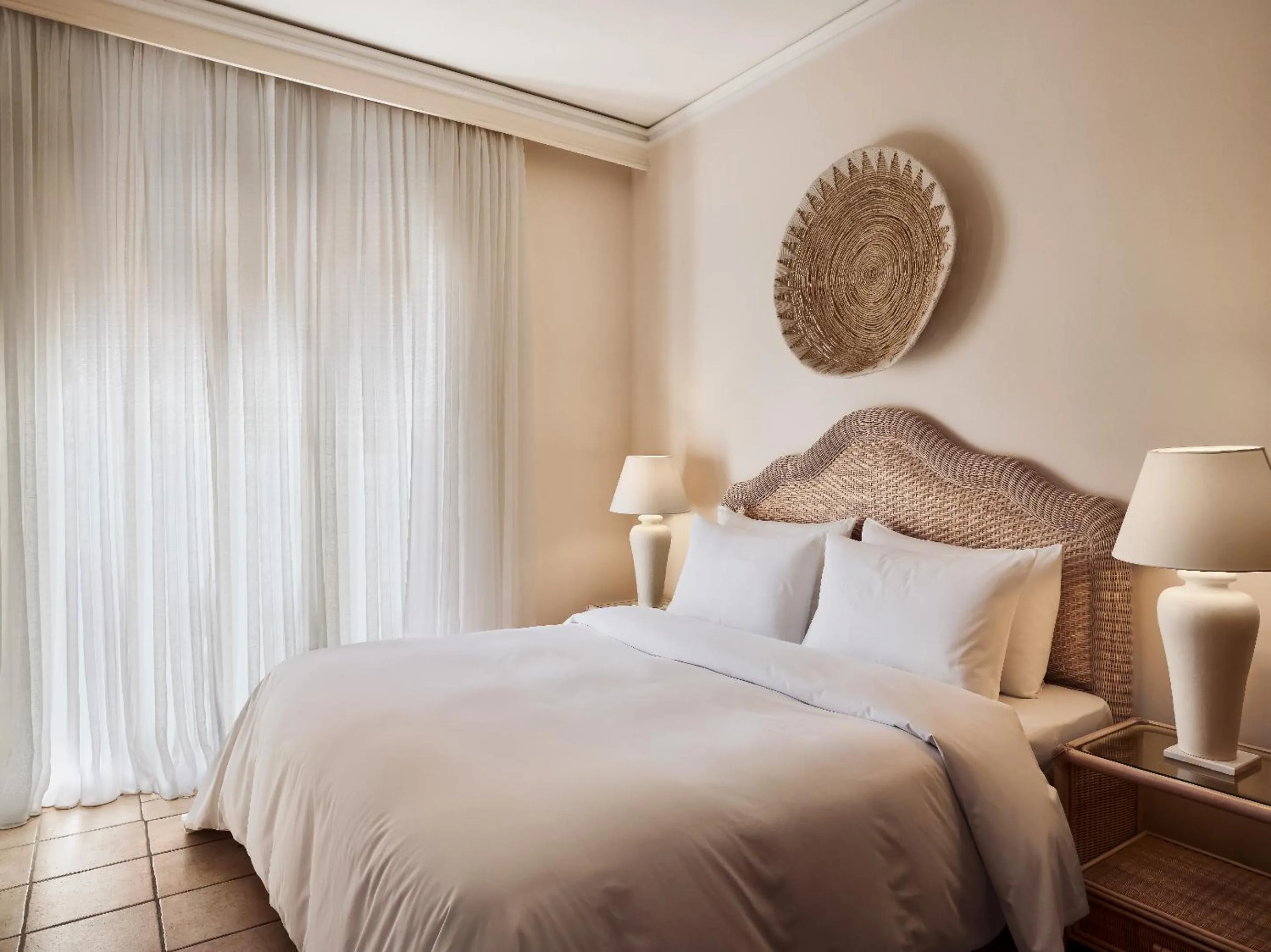 Bed in Grecotel Plaza Beach House